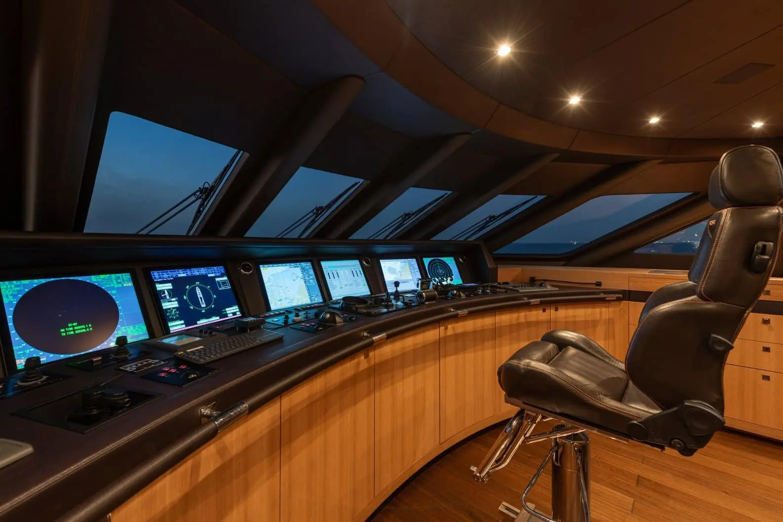 Heesen 5000 wheelhouse helm console with navigation screens