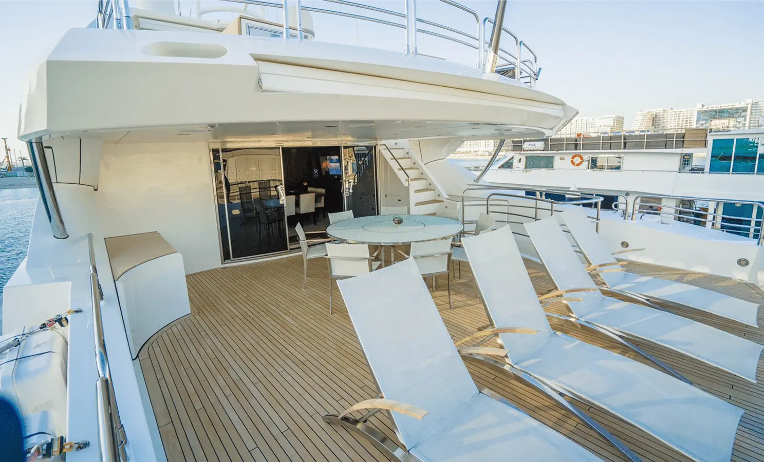 Sunseeker 40M bridge deck aft sun loungers by the marina