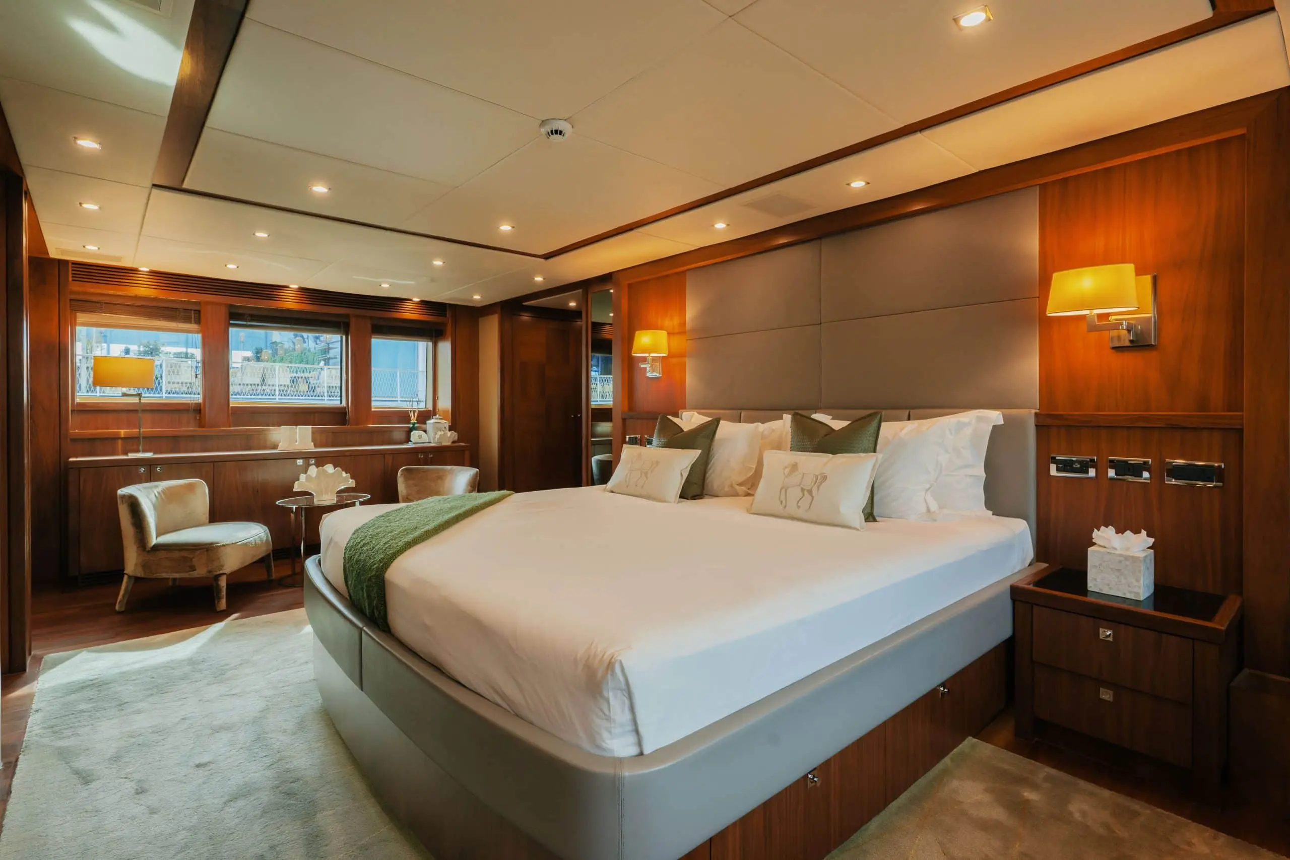 Aurora 130 yacht luxury bedroom with king-size bed and large windows