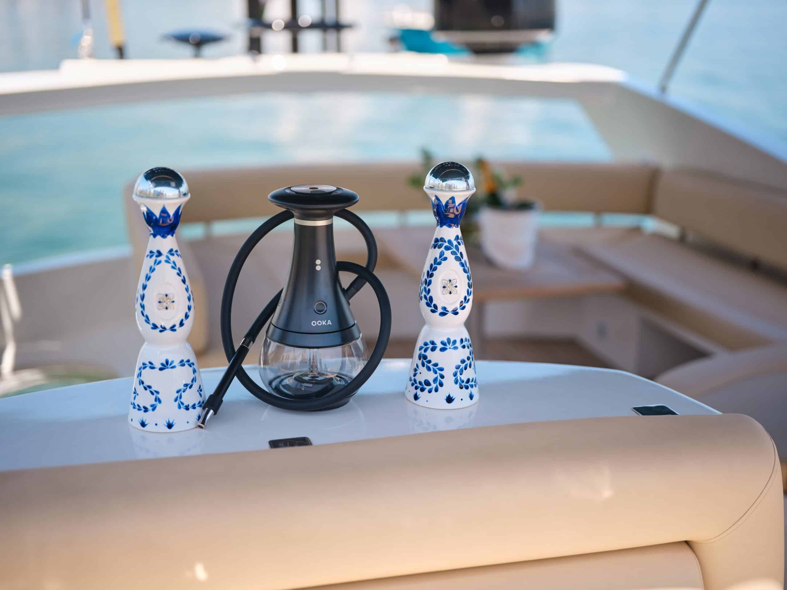Decorative ceramic bottles on a luxury yacht seating area.
