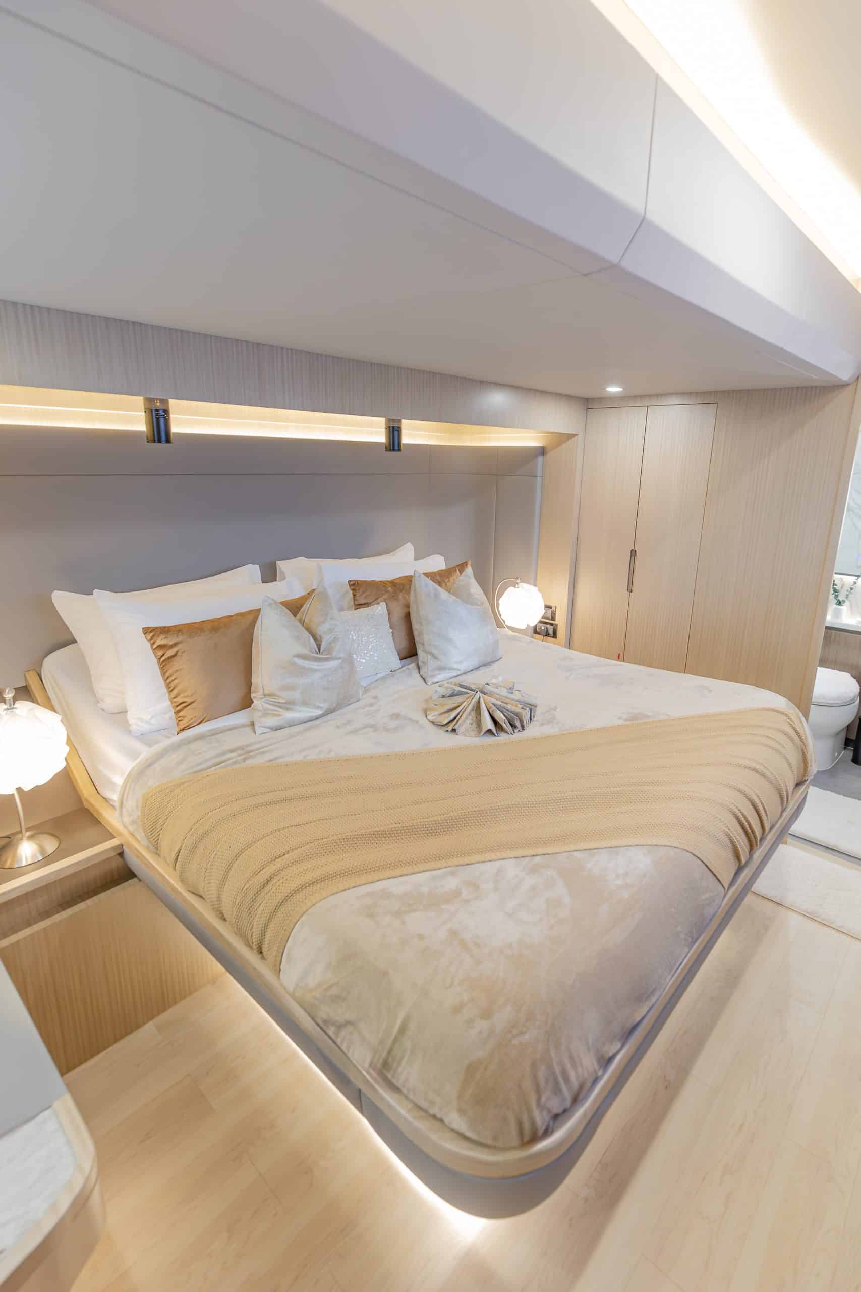 Zirve 72 master cabin with king-size bed and modern indirect lighting
