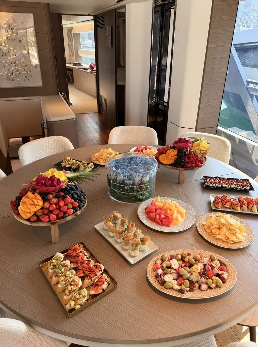 Luxury yacht catering food spread with gourmet dishes and appetizers onboard