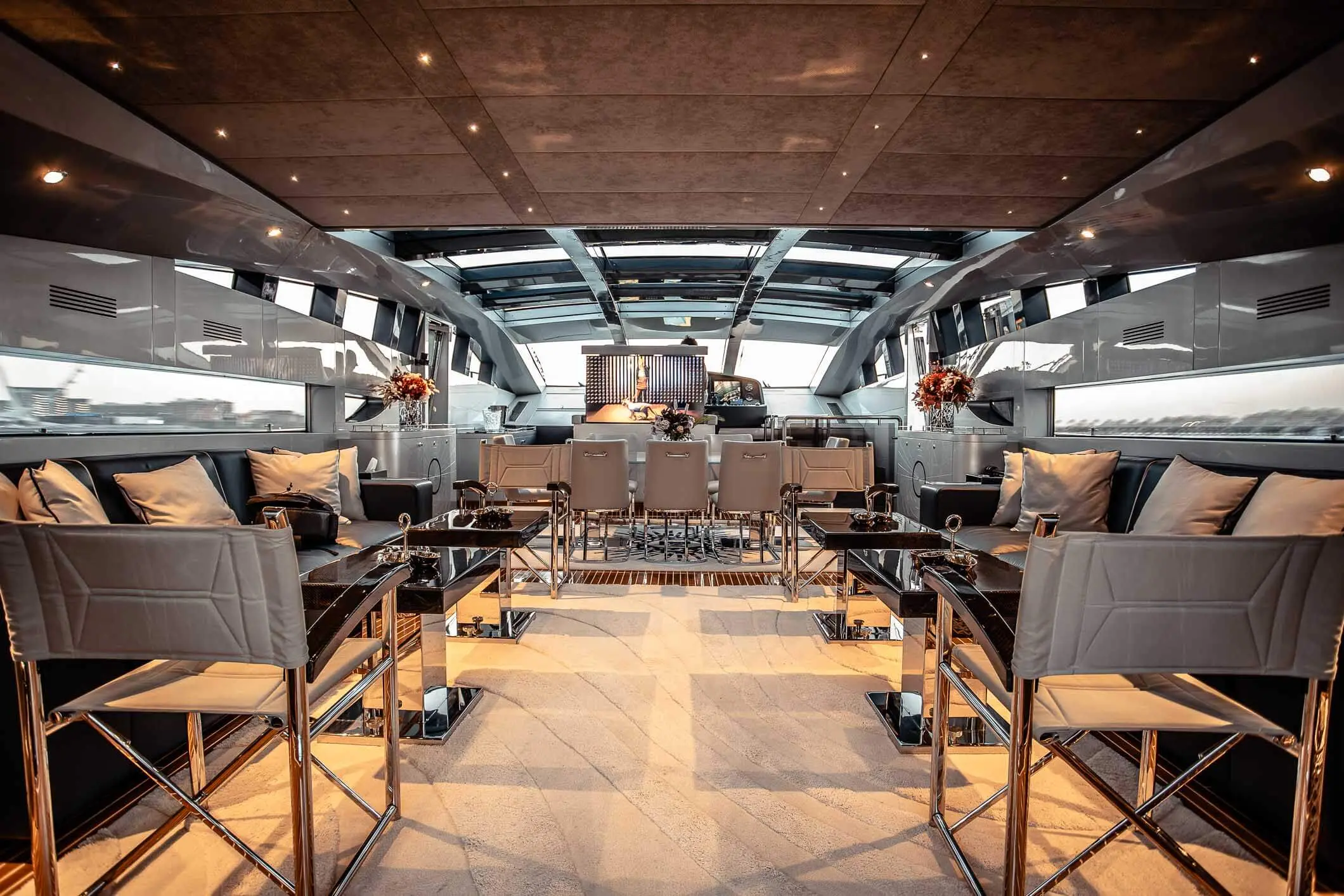 Baglietto 105 HT main saloon with bar and warm oak finish