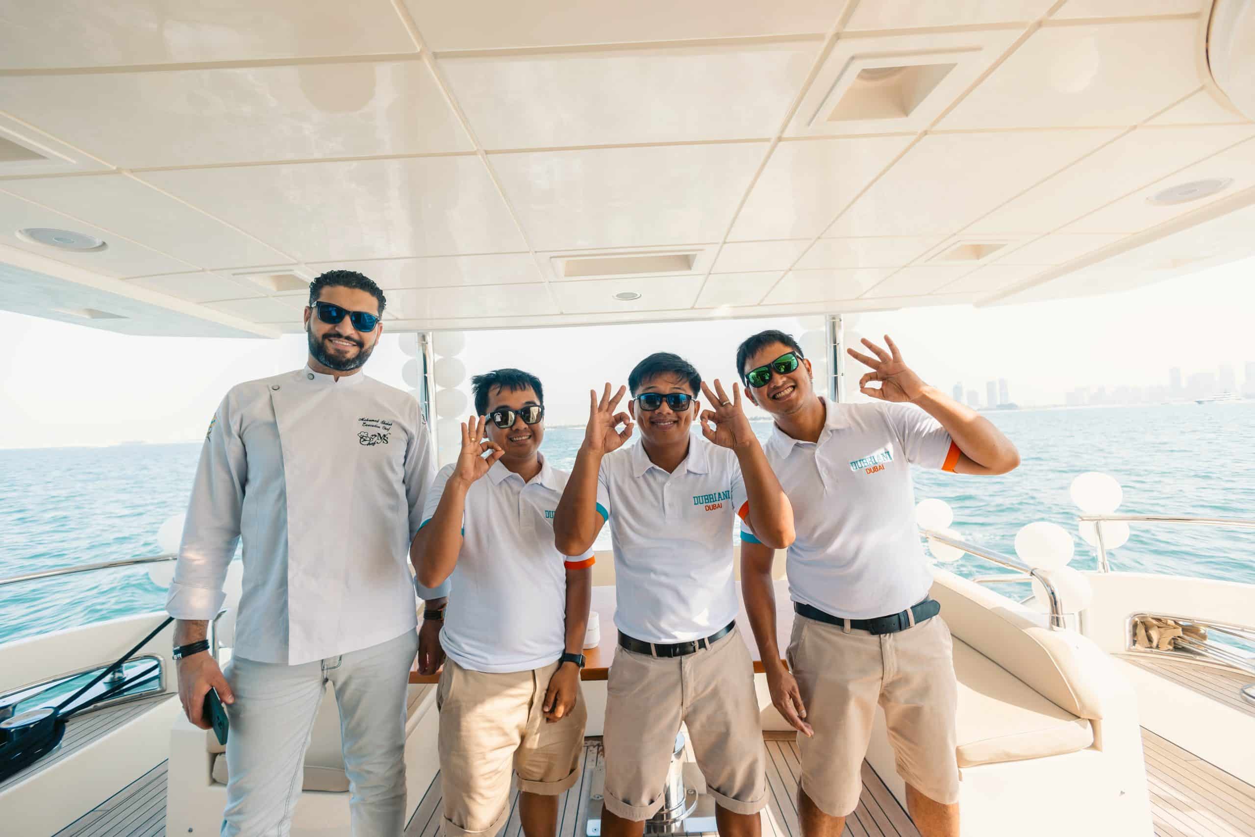 Friends posing for birthday yacht party photo on luxury yacht in Dubai