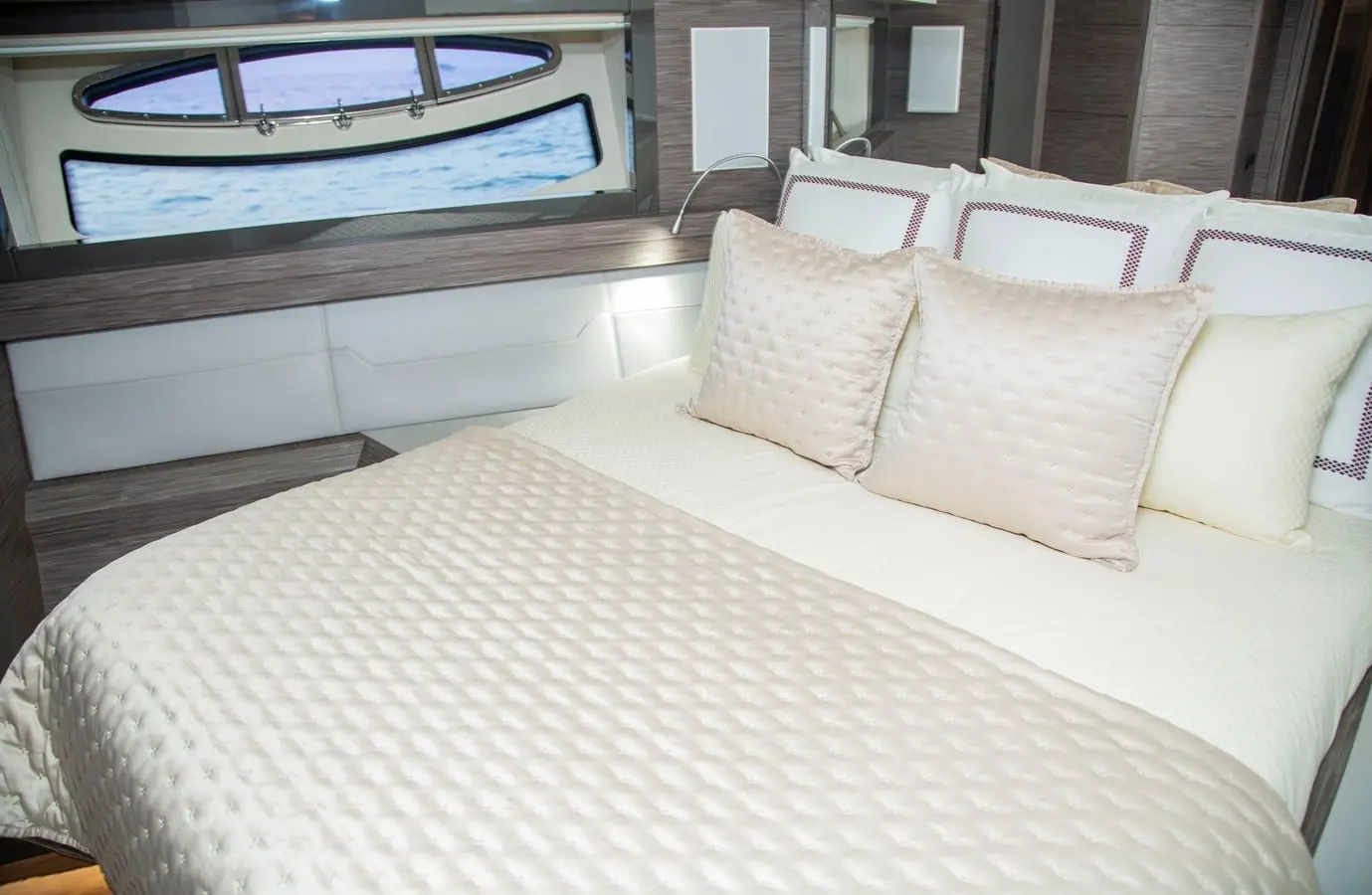 Pershing 82 double cabin berth beside the hullside window