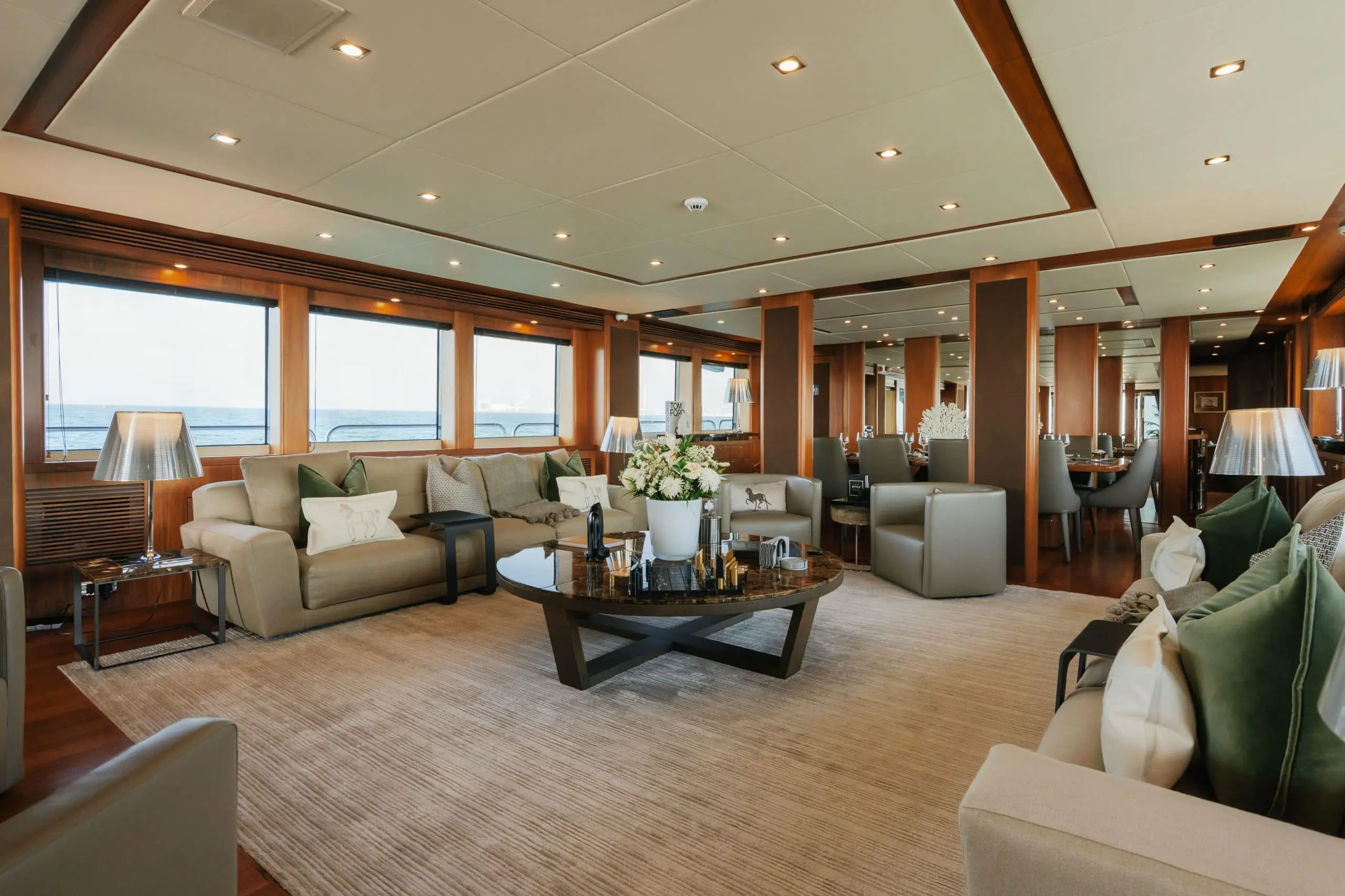 Aurora 130 superyacht interior lounge with premium sofas and central coffee table