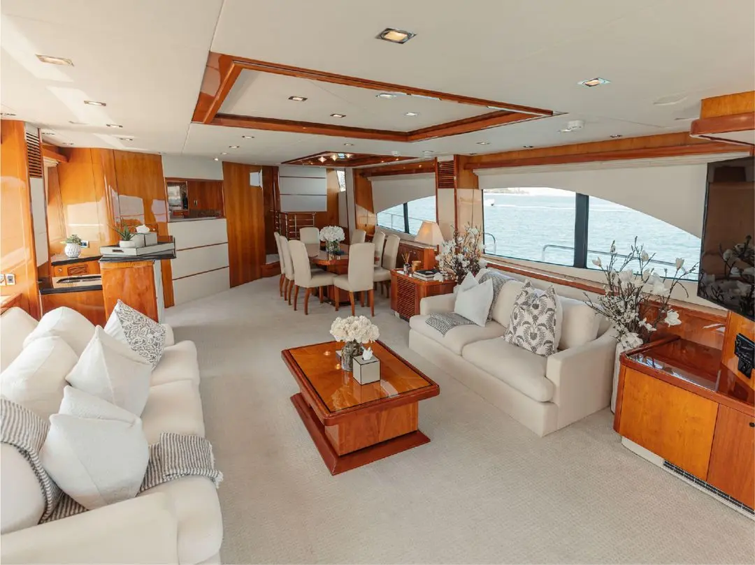 Spacious main salon of Notorious luxury yacht with sofas and wooden coffee table
