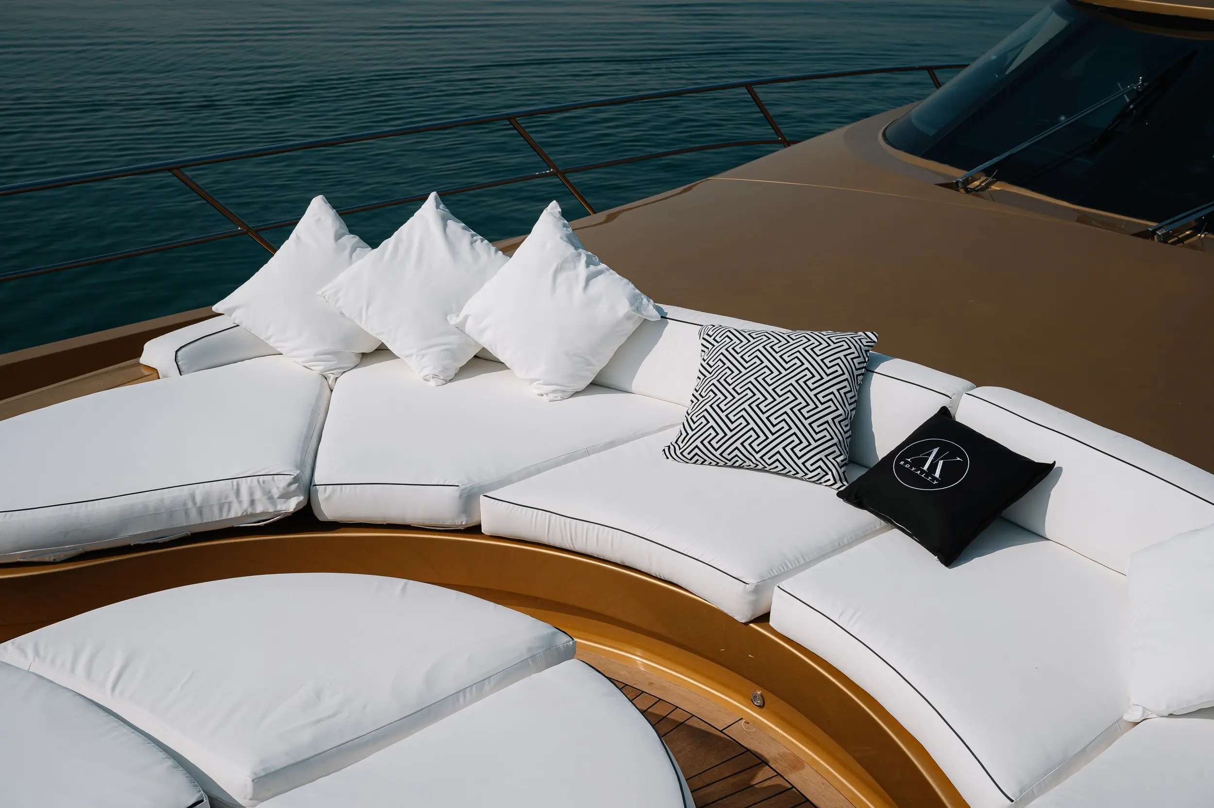 Luxury bow seating area with cushions on Royalty 136 yacht