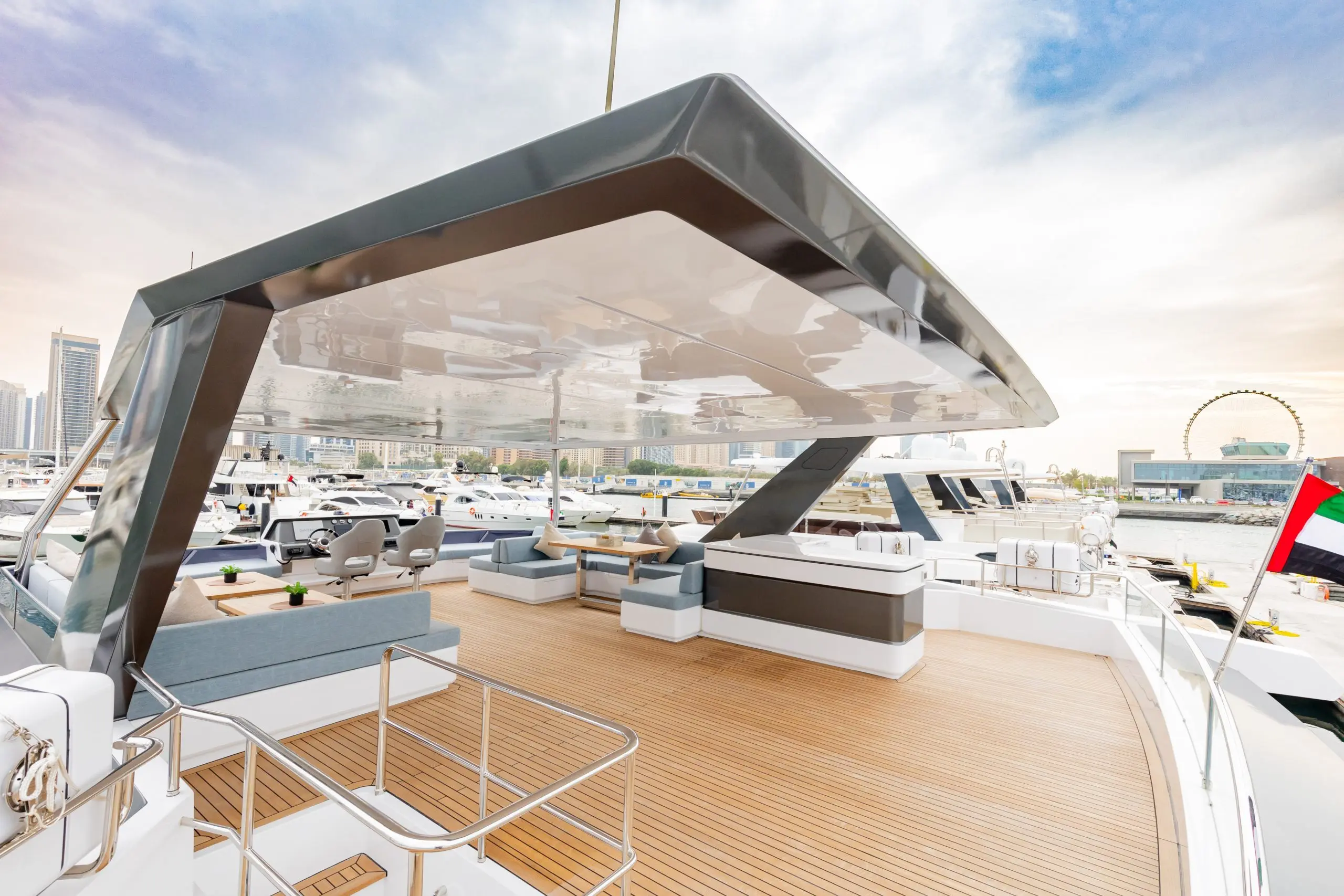 Zirve 72 yacht upper deck with shade canopy and stylish seating arrangement
