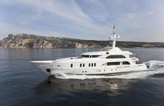 Athena 170 luxury yacht anchored near Mediterranean coastline