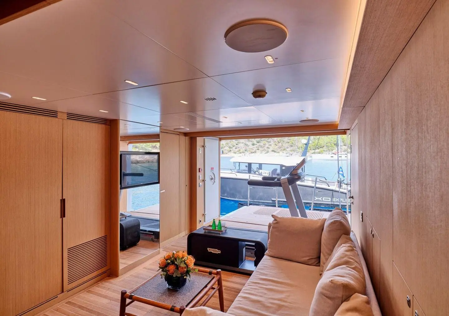 Sanlorenzo 500EXP beach club lounge opening to the swim platform, broker photo