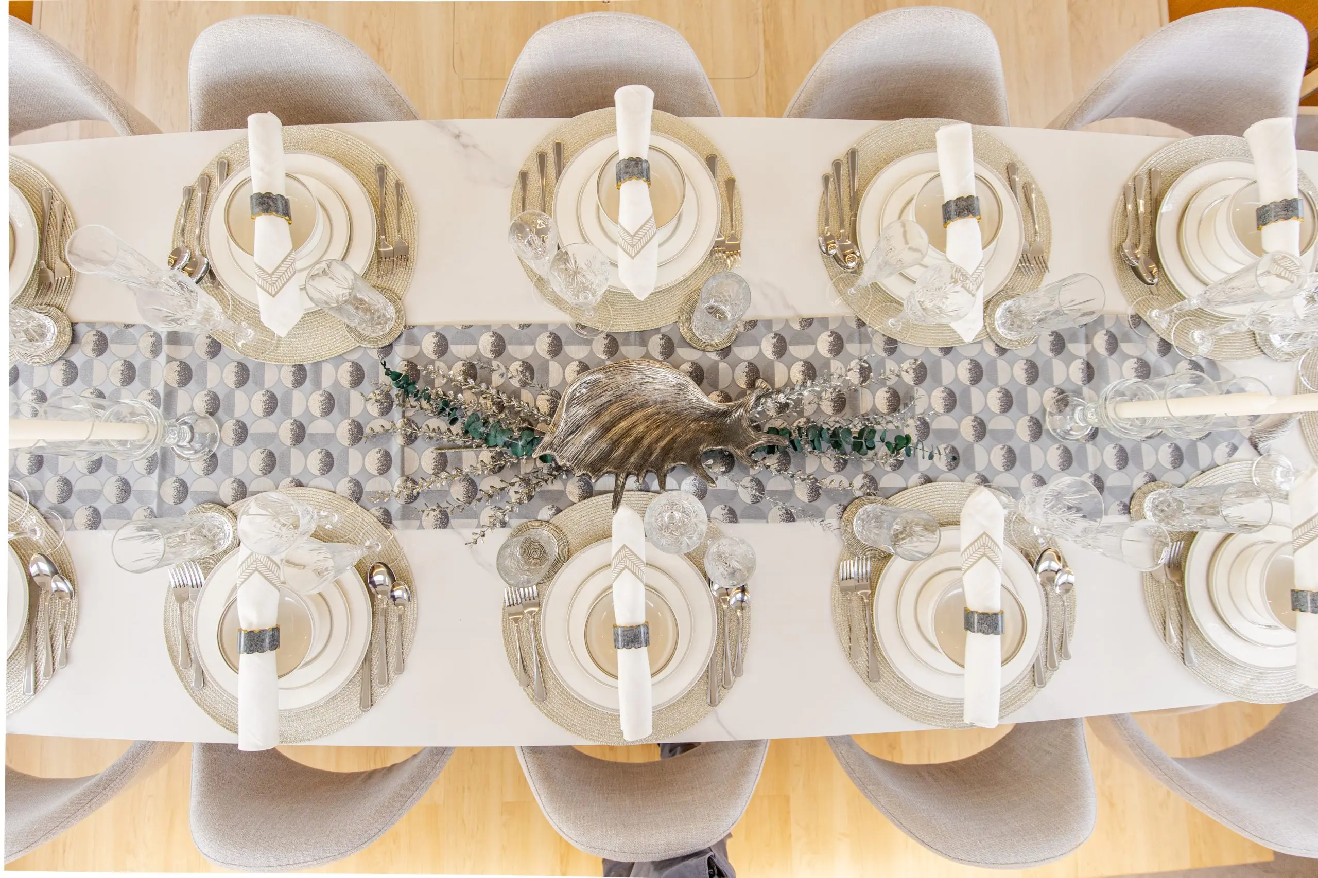 Elegant dining table setup on the Zirve 72 yacht with decorative white floral arrangements