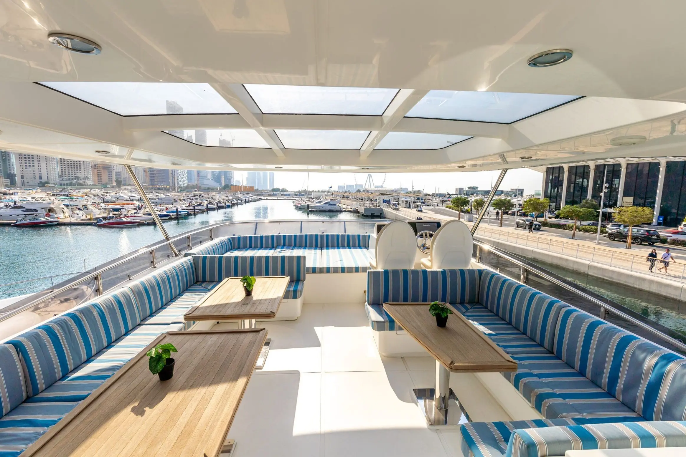 Cante 97 yacht flybridge seating area with blue cushions