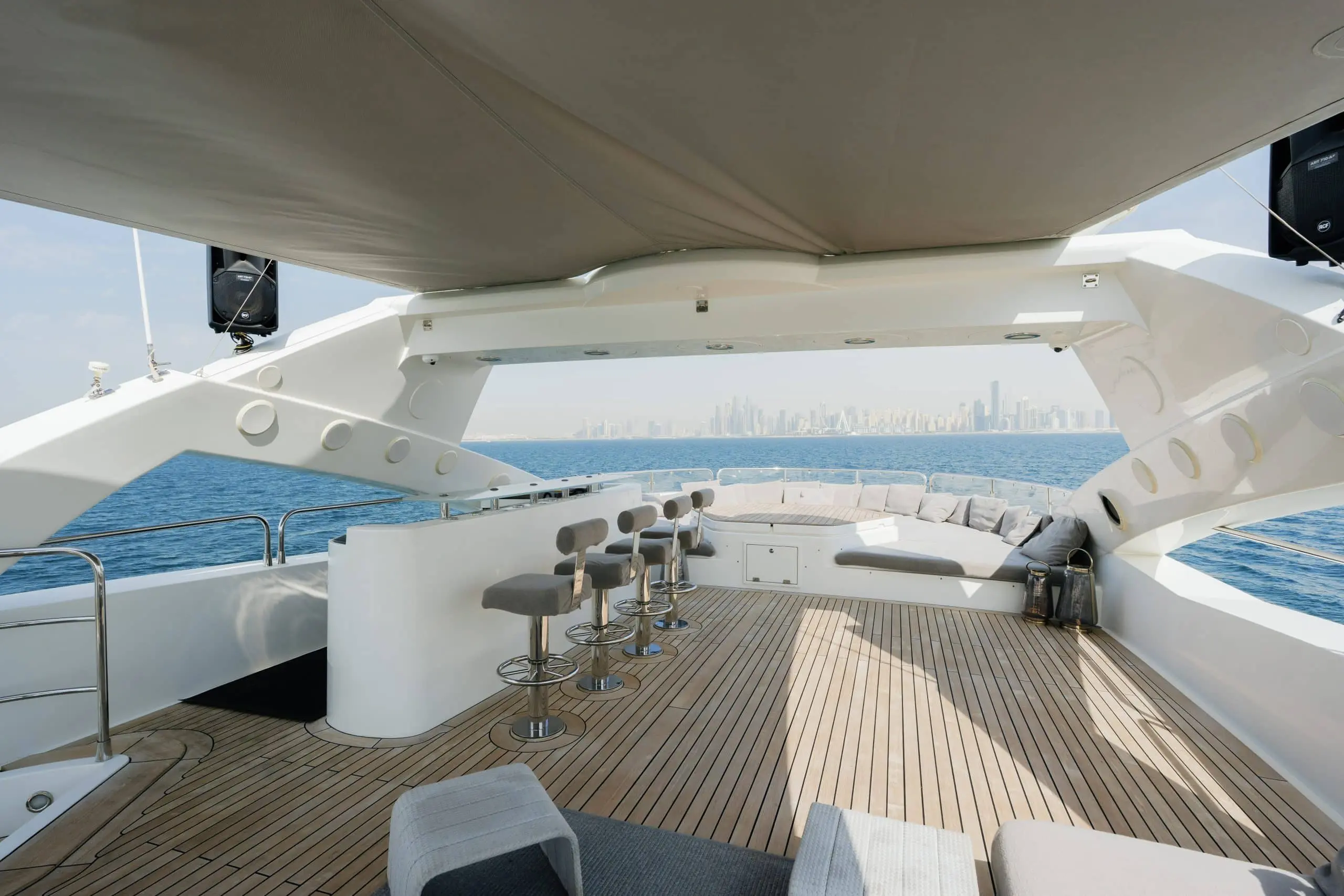 Aurora 130 superyacht upper deck lounge with shaded seating area