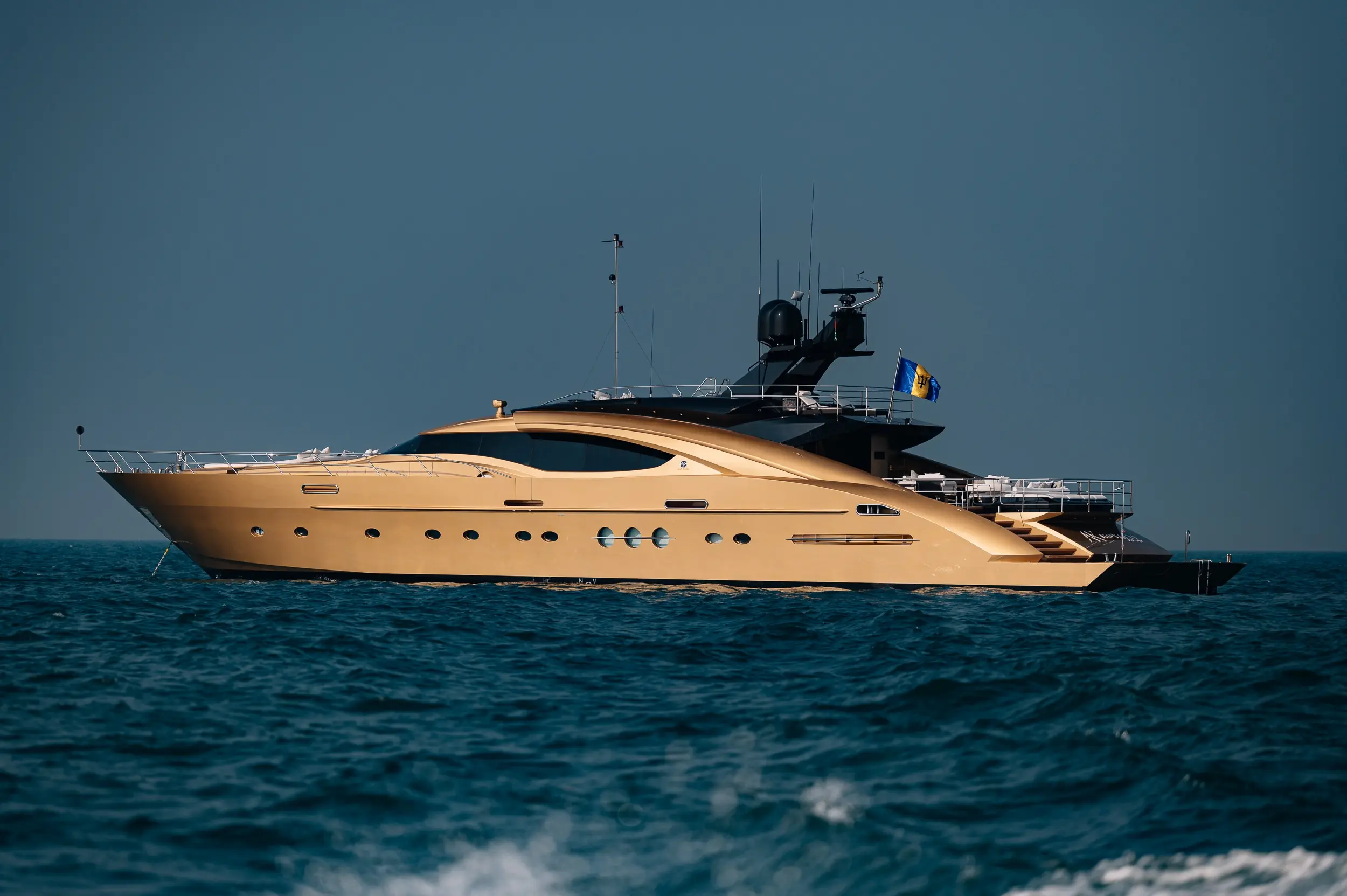 Side view of Royalty 136 luxury yacht sailing on open sea