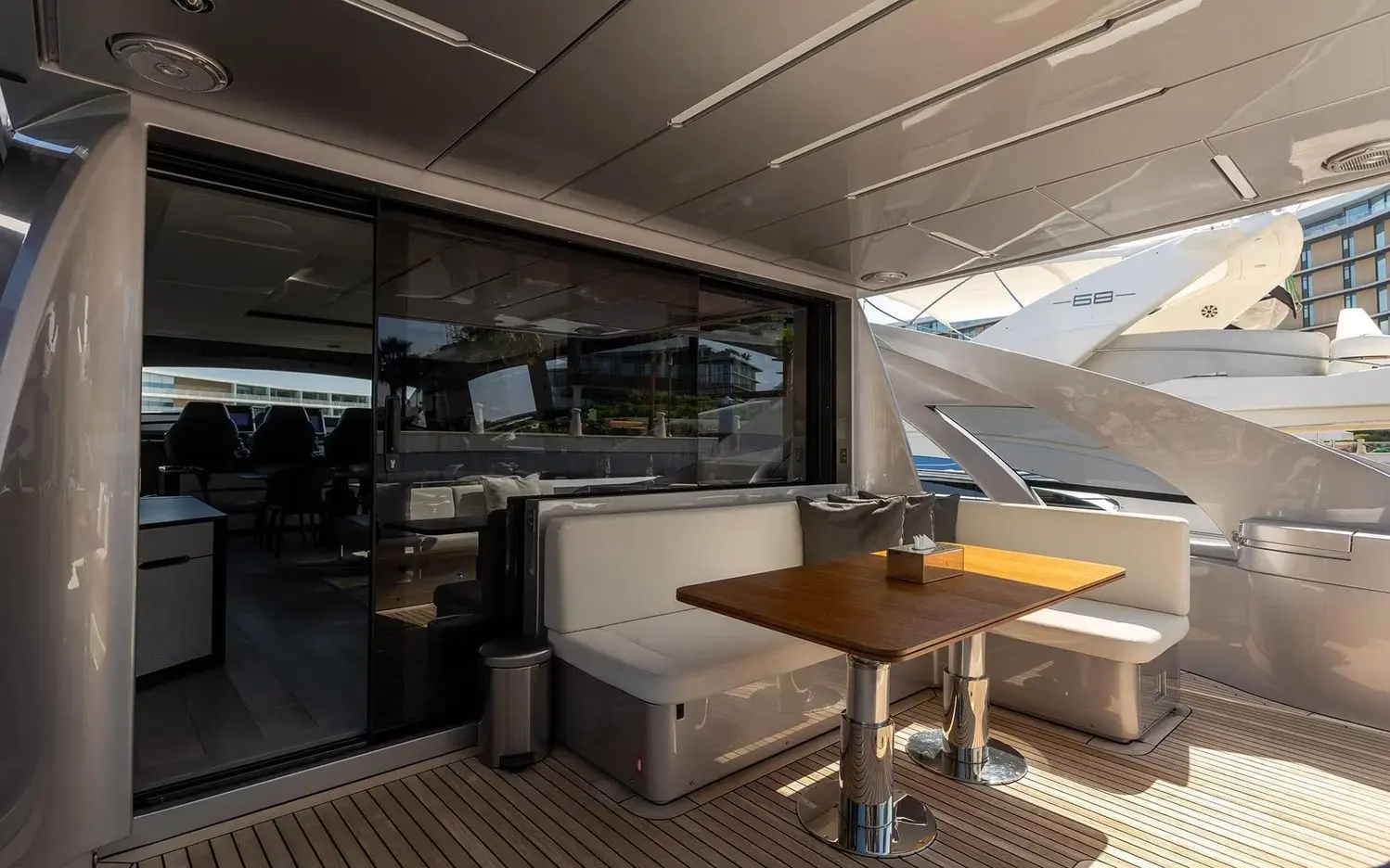 Pershing 8X aft cockpit with dining table and bench seating
