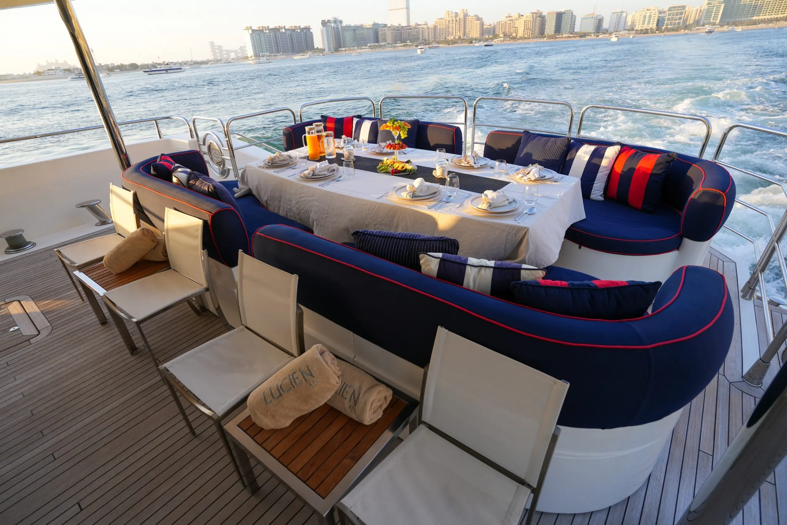 Flybridge lounge seating area on Sunseeker 131 yacht with cushioned sofas and ocean views