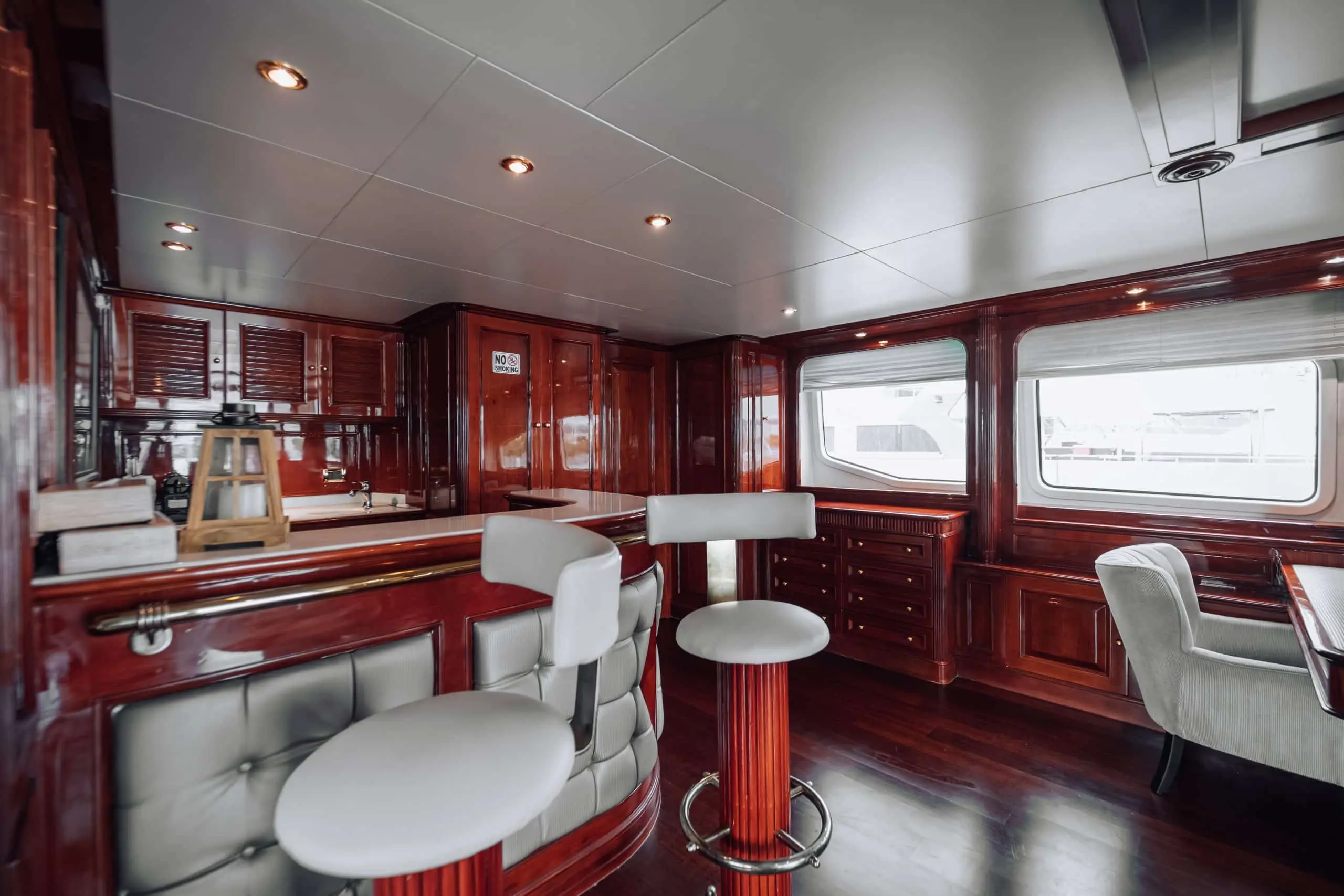Upper deck lounge area on Royal Mirage yacht with leather seating
