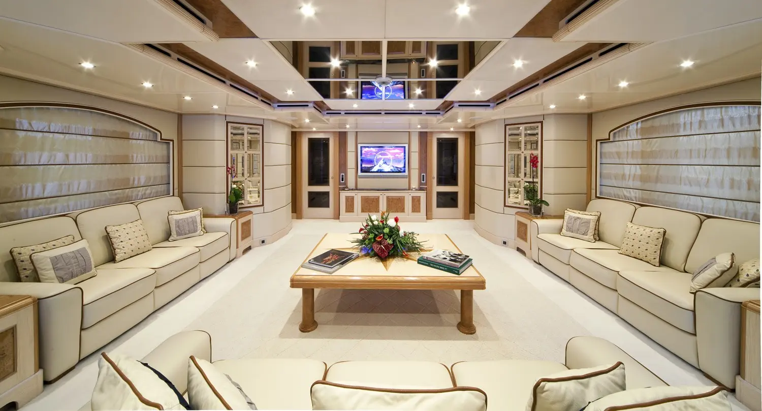 Athena 170 yacht formal dining room with long table and elegant décor