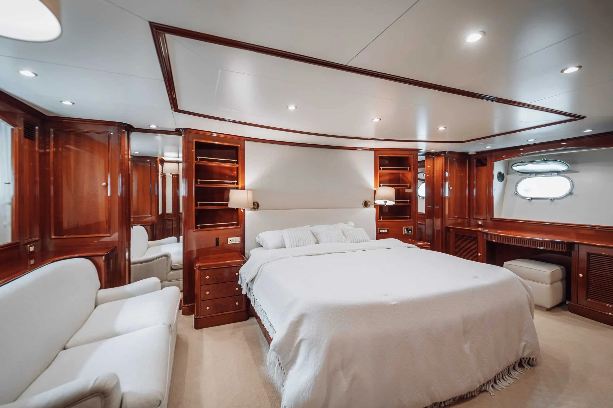 Royal Mirage yacht master cabin with king size bed and wooden interior