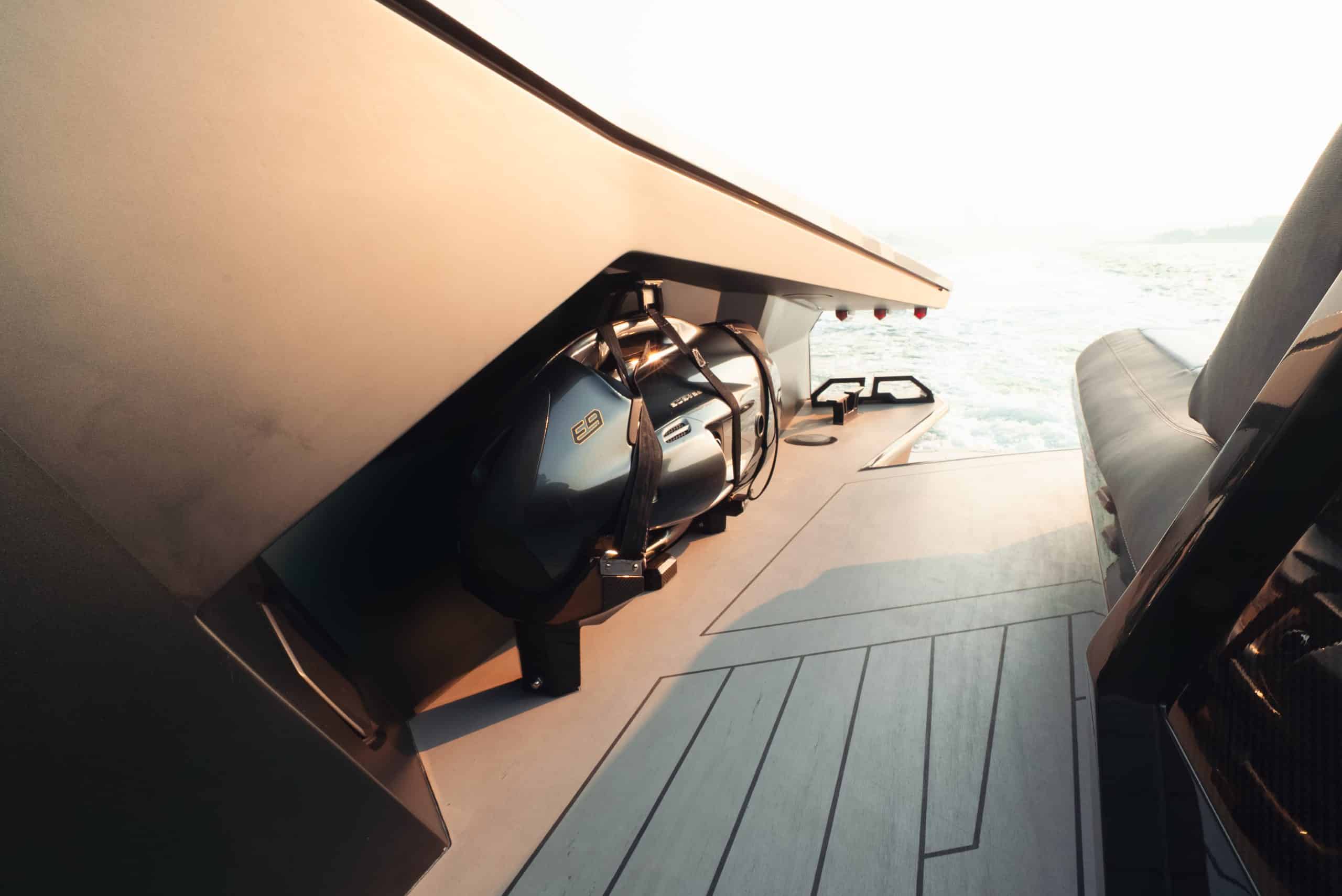 Lamborghini 63 yacht foredeck lounge area with sunbed and carbon fiber detailing at sunset