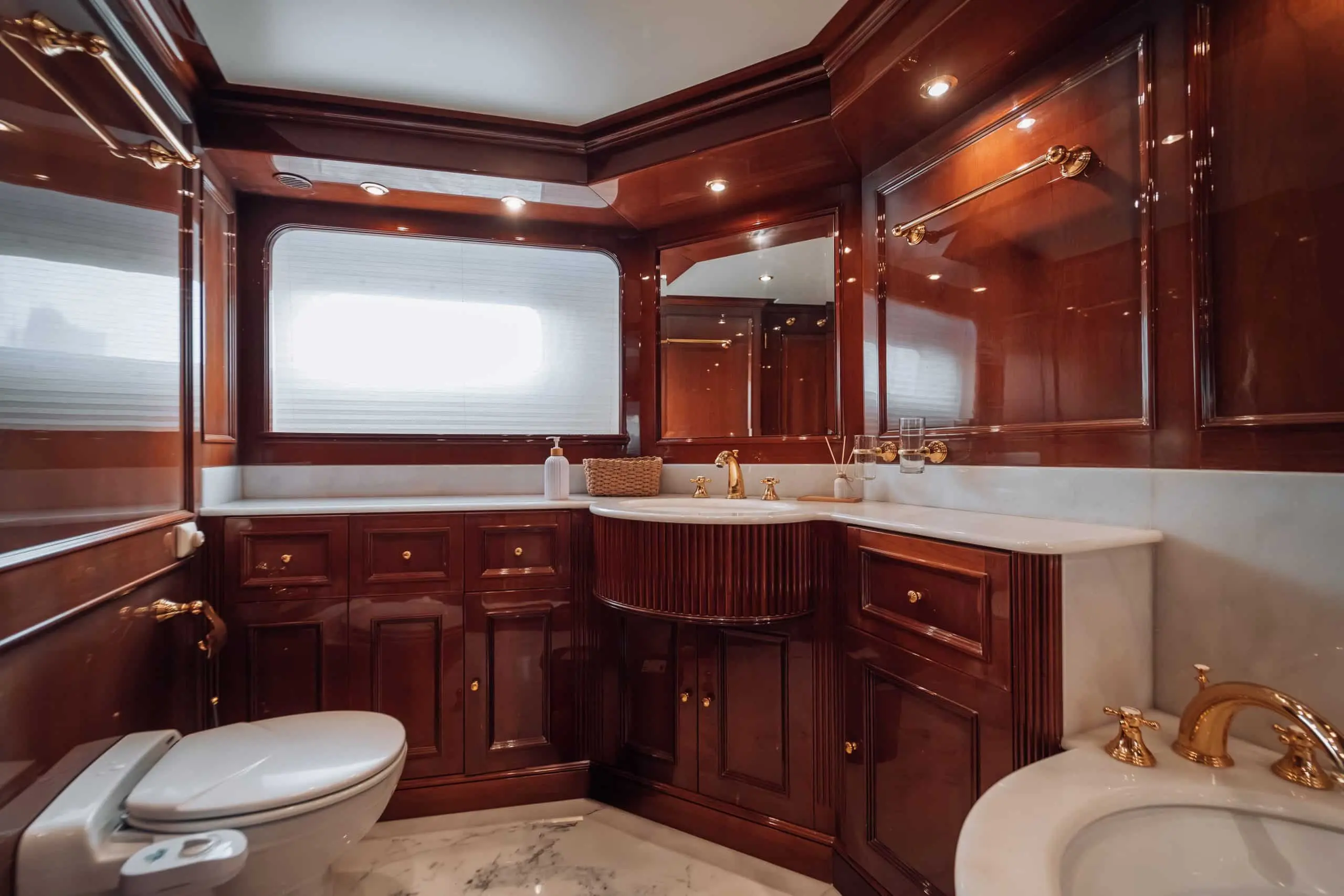Twin guest cabin on Royal Mirage yacht with wooden interior and ensuite access