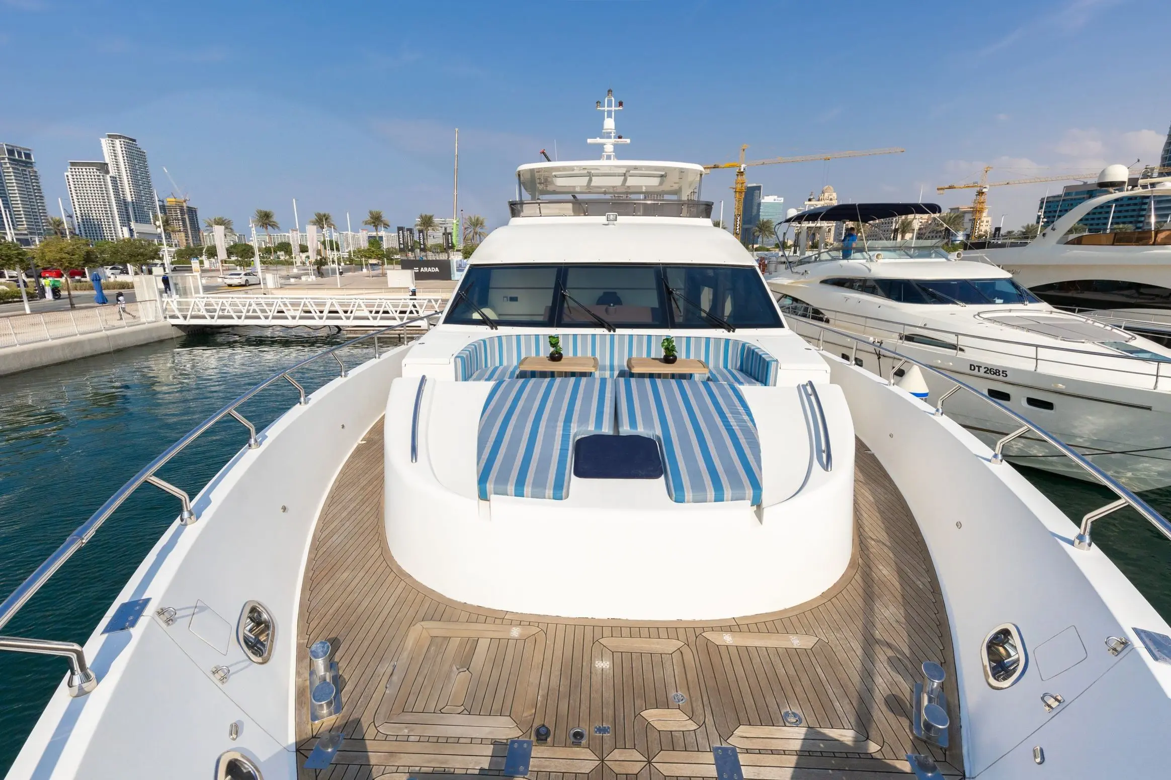 Cante 97 yacht foredeck sunbeds with panoramic Dubai views