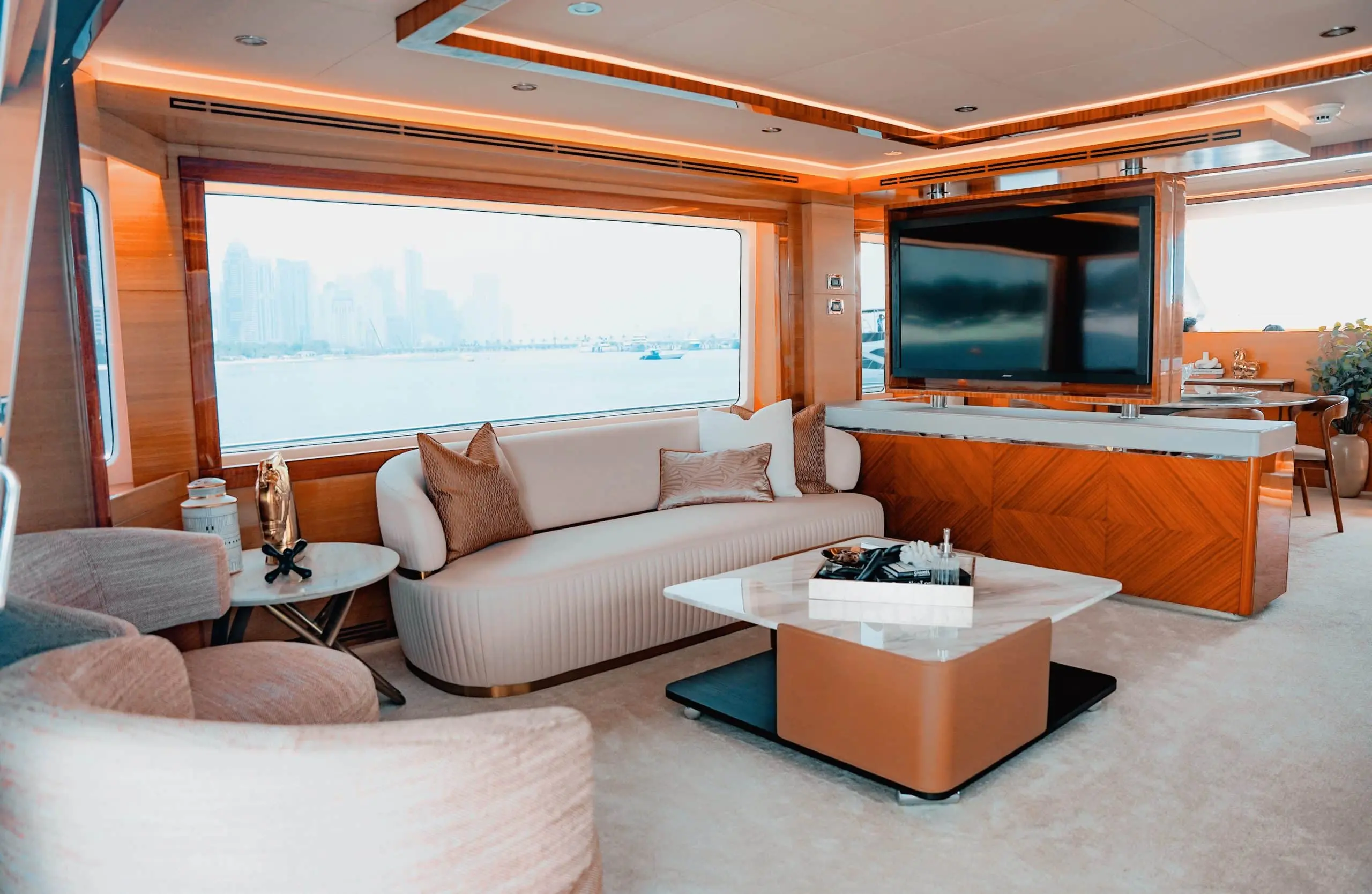 Carina 75 yacht interior lounge with panoramic water views and modern furnishings