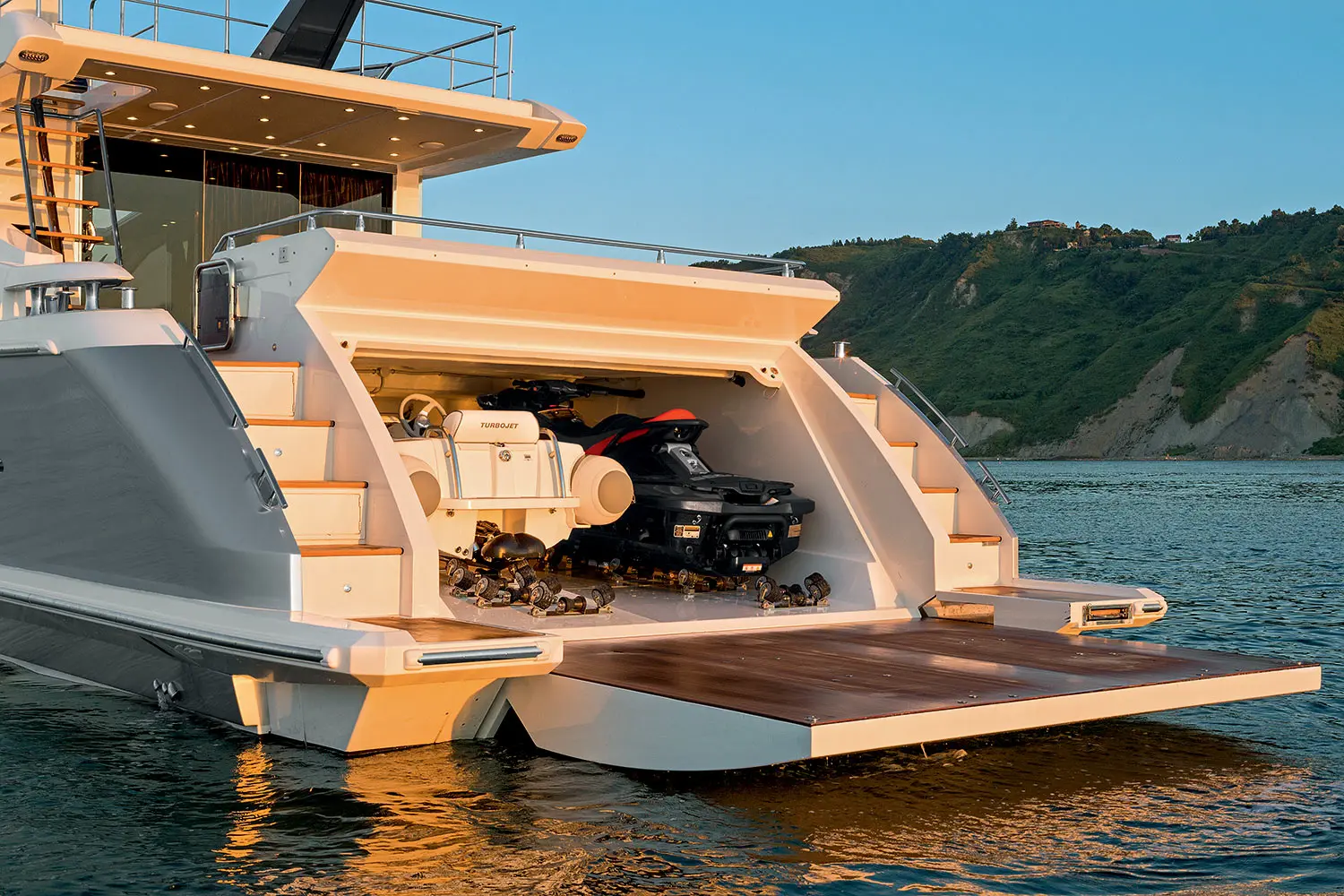 Azimut 77S stern garage open with tender and jet ski — shipyard photo