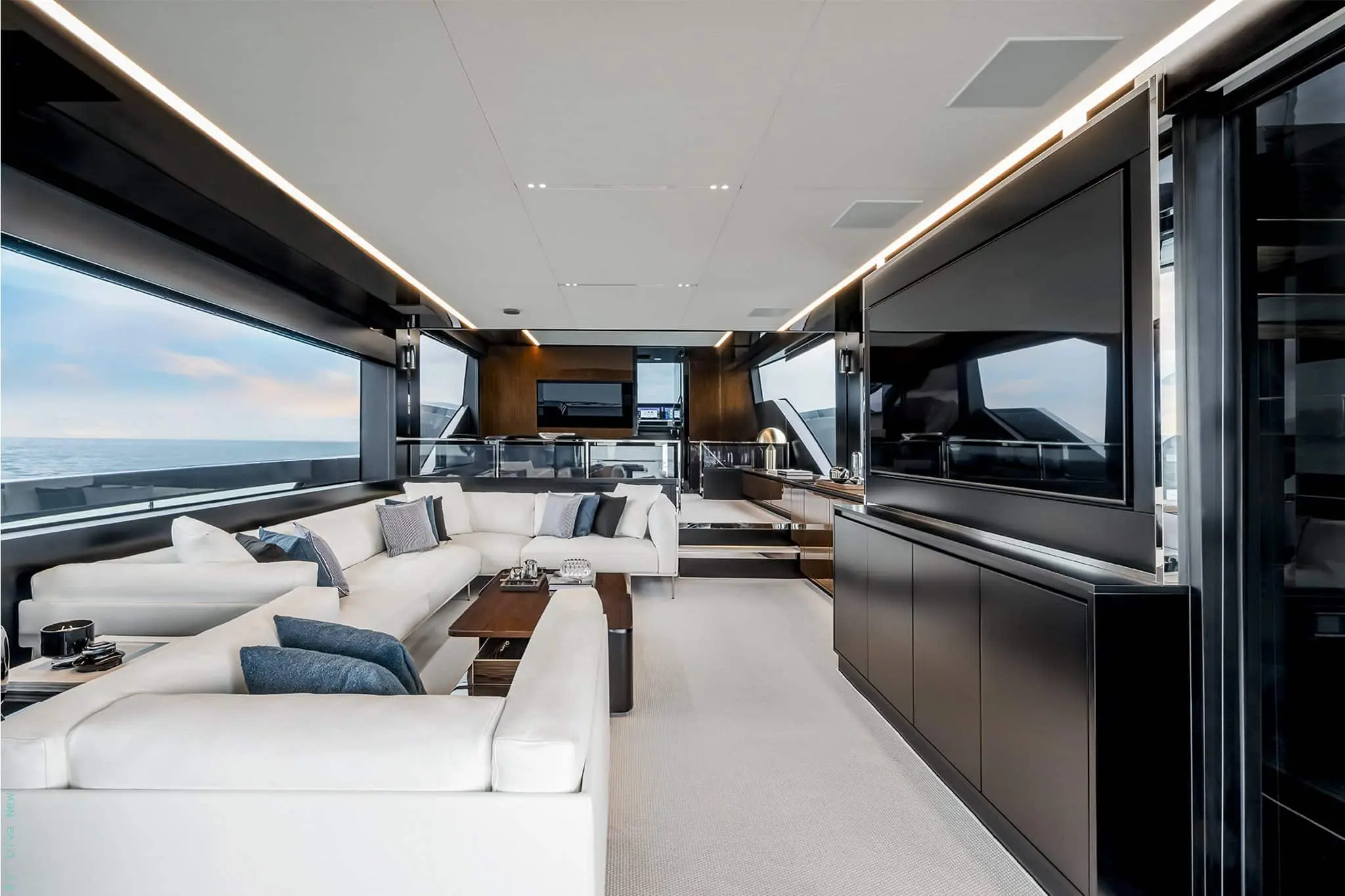 Riva 82 Diva main saloon with white sofas and dark gloss joinery