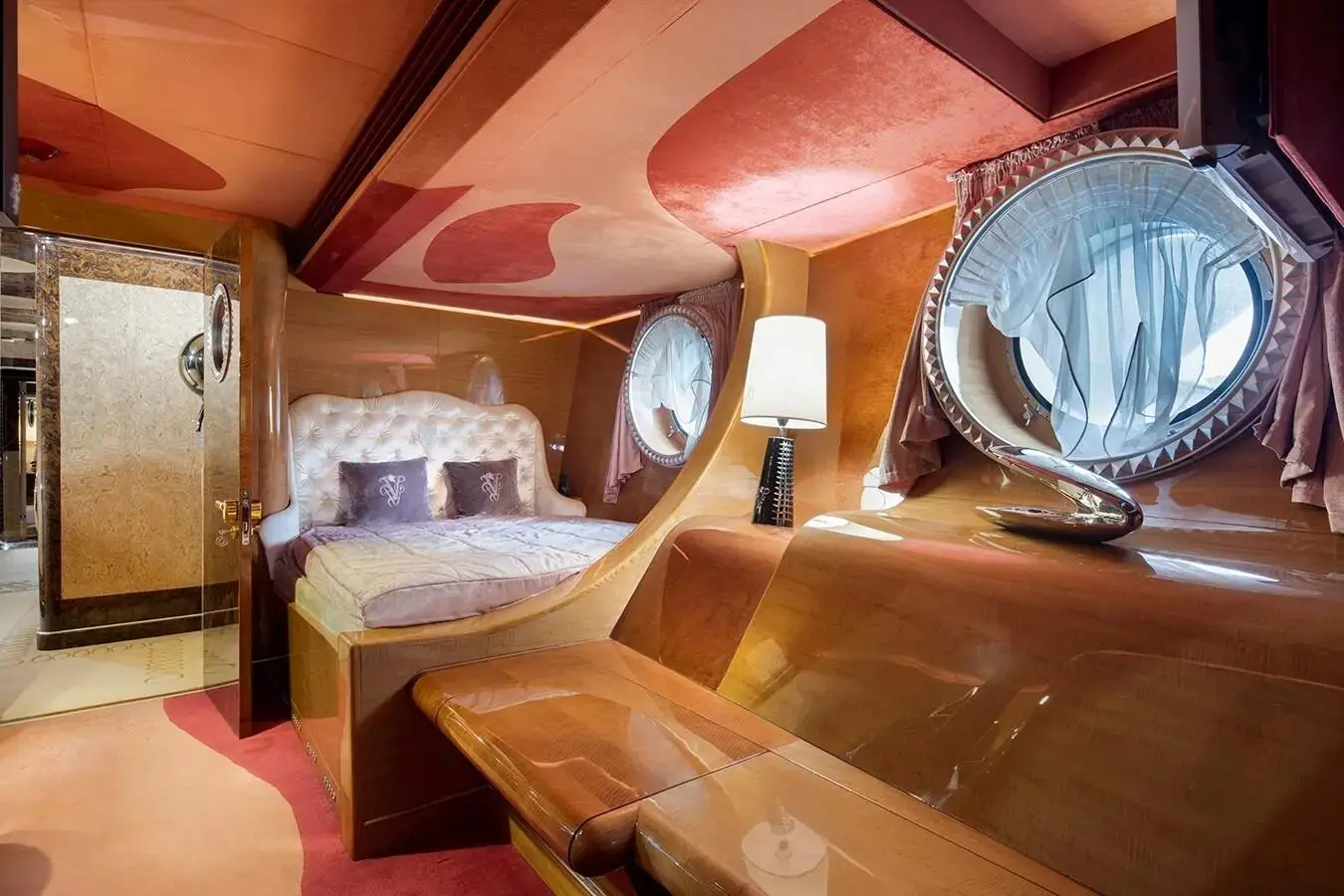 Thunder Superyacht twin guest cabin with warm lighting and wooden finish
