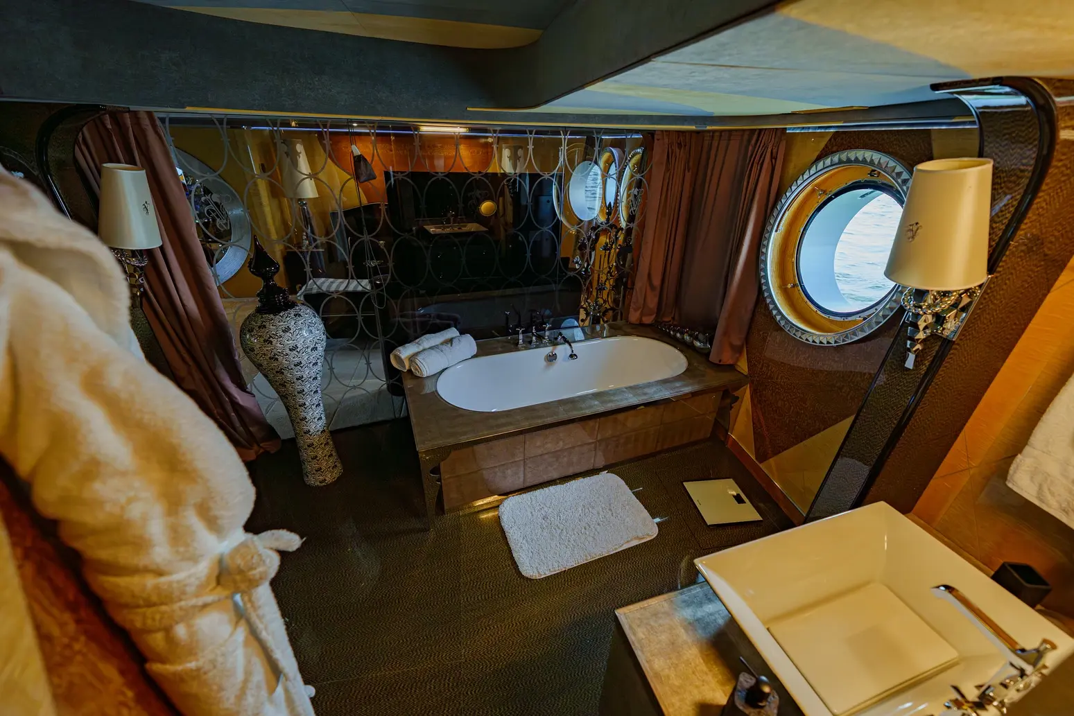 Thunder Superyacht luxury cabin with wooden interior and workspace desk