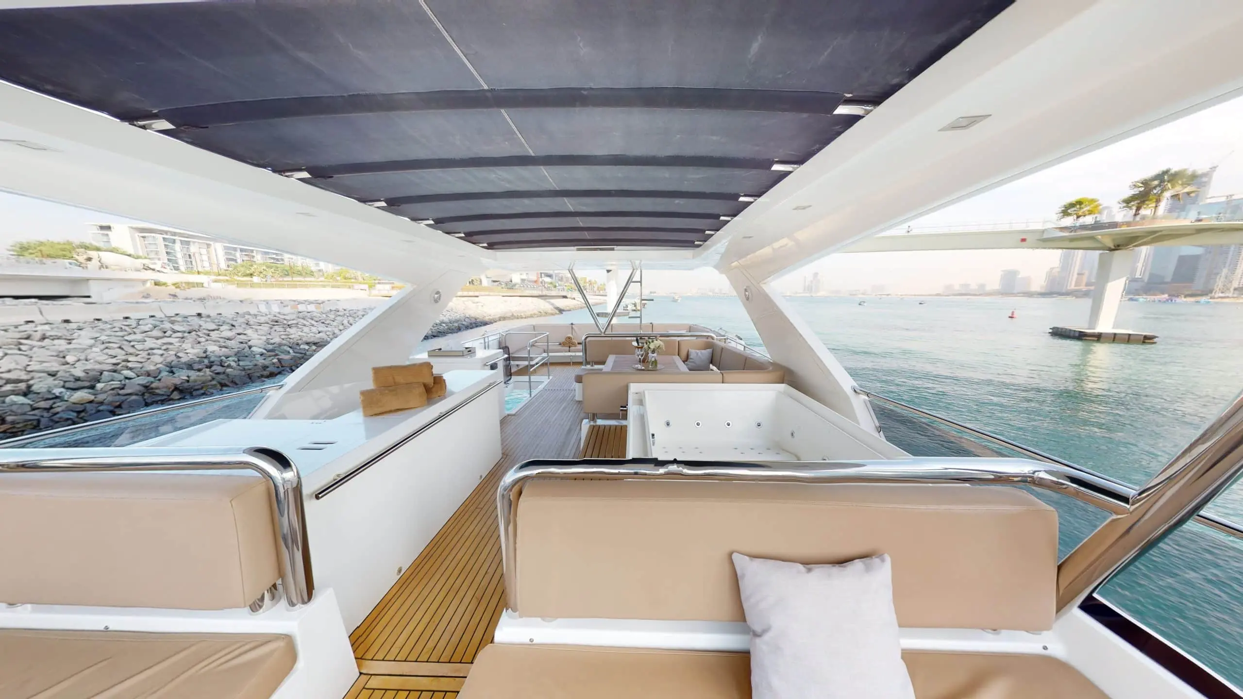 Galeon 780 F1 luxury yacht rear seating lounge with premium cushions and teak deck