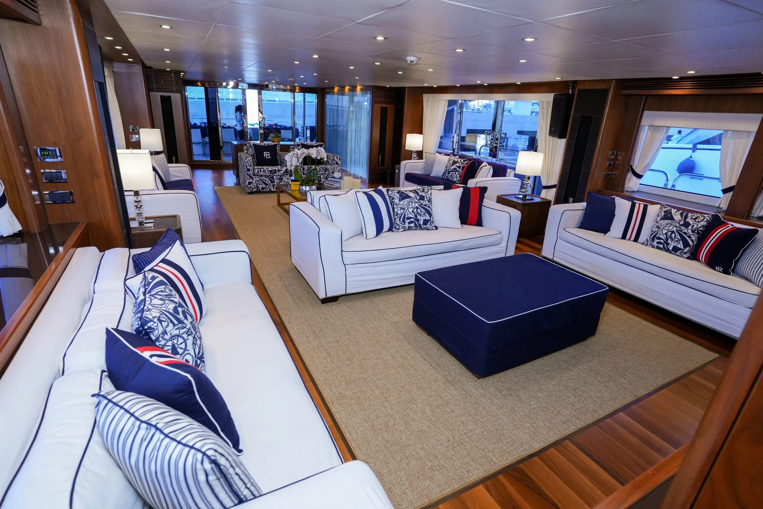 Spacious living area on Sunseeker 131 yacht with cream sofas and modern furnishings