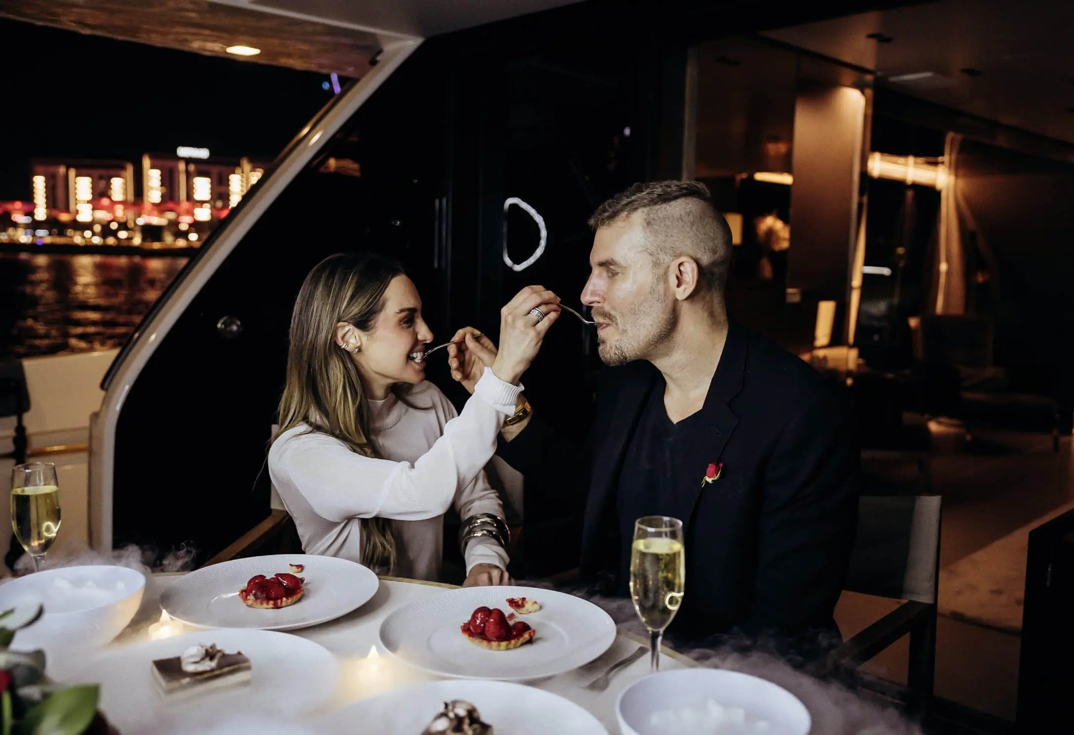 Couple enjoying private romantic dinner on yacht in Dubai