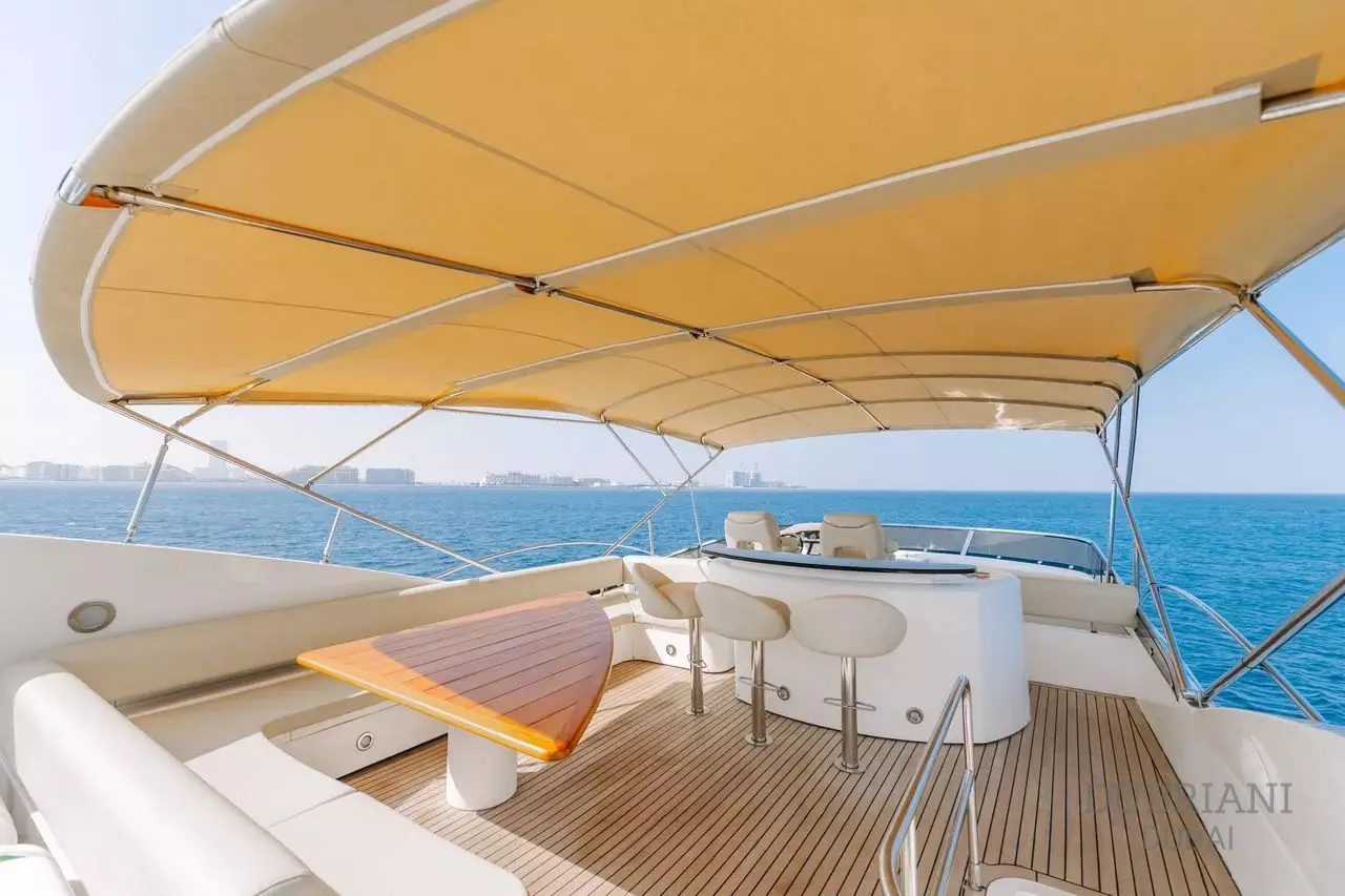 Sunseeker 88 yacht flybridge dining area with sea view