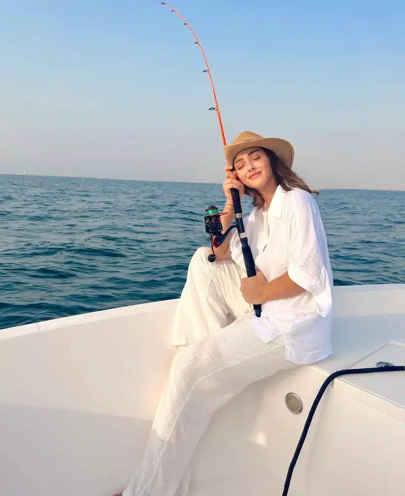 Woman enjoying private fishing yacht experience in Dubai waters