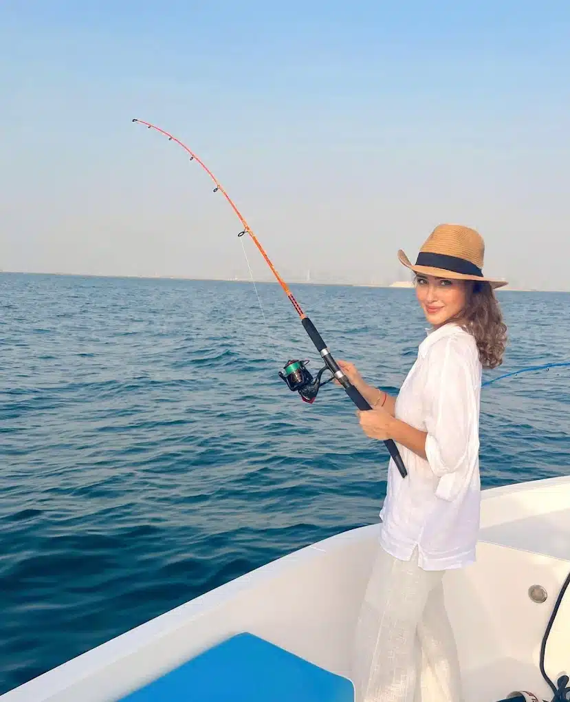 Guest fishing during private deep sea fishing trip in Dubai