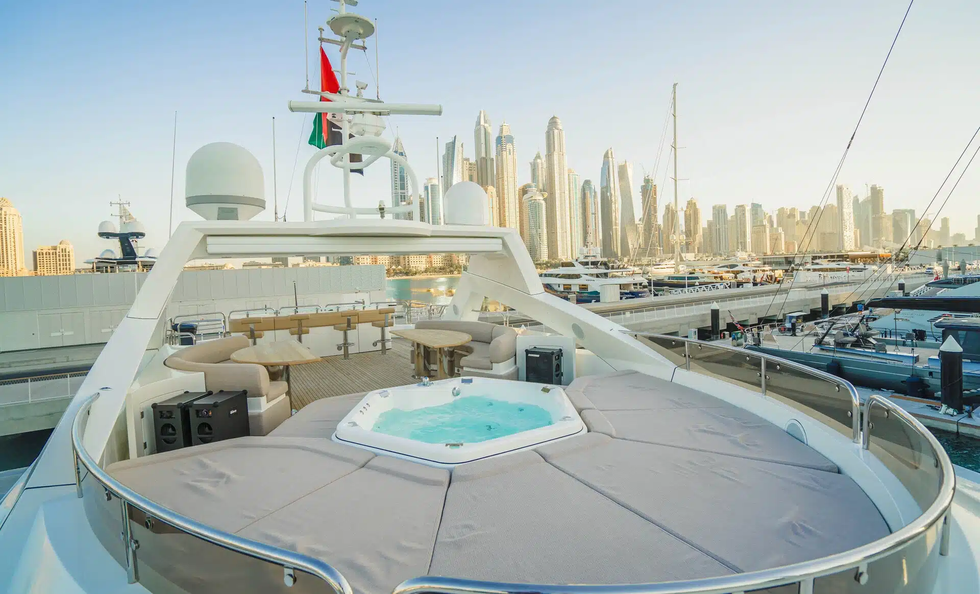 Jacuzzi on flybridge deck of Sunseeker 131 yacht overlooking Dubai skyline