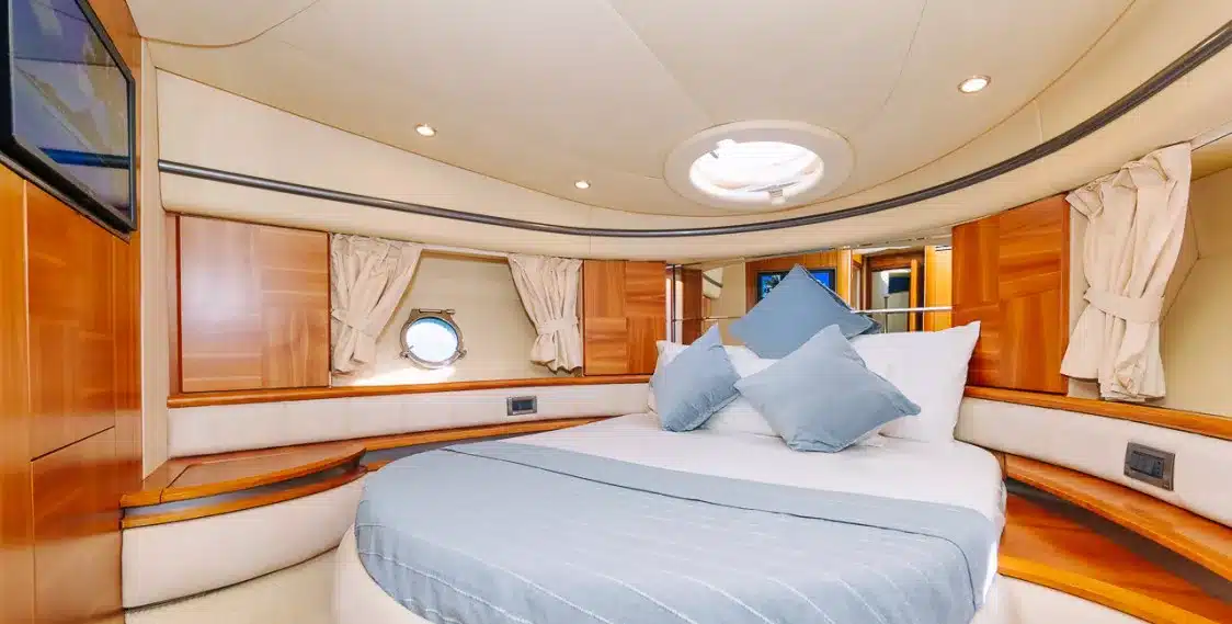 Bliss 55 yacht master cabin with circular bed and teak wood finish