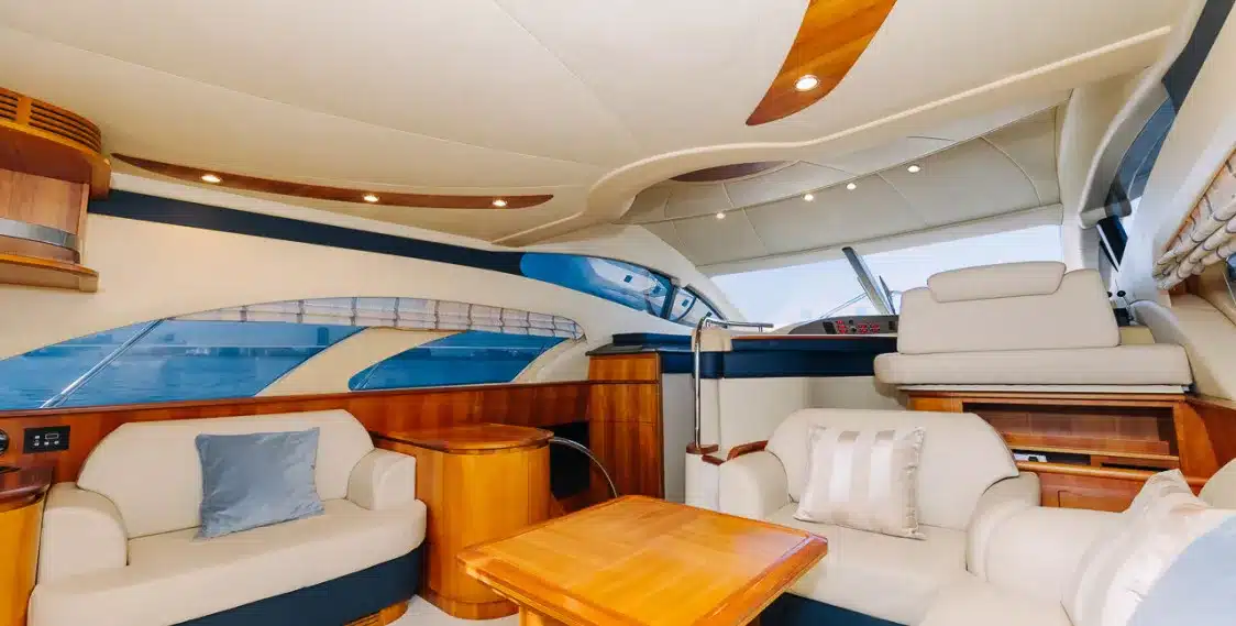 Bliss 55 yacht luxury salon with cream seating and teak wood table