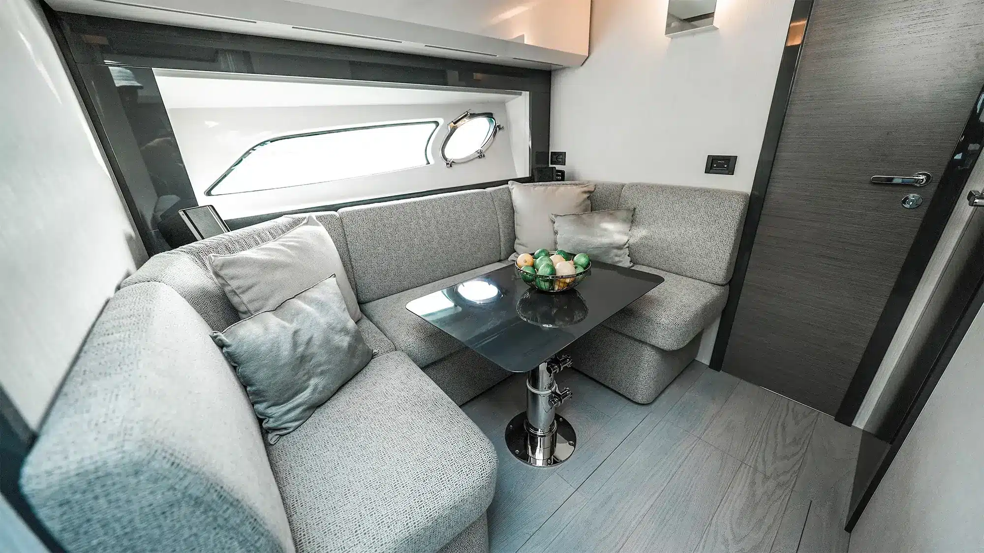 Saloon settee and coffee table aboard the Pershing 5X