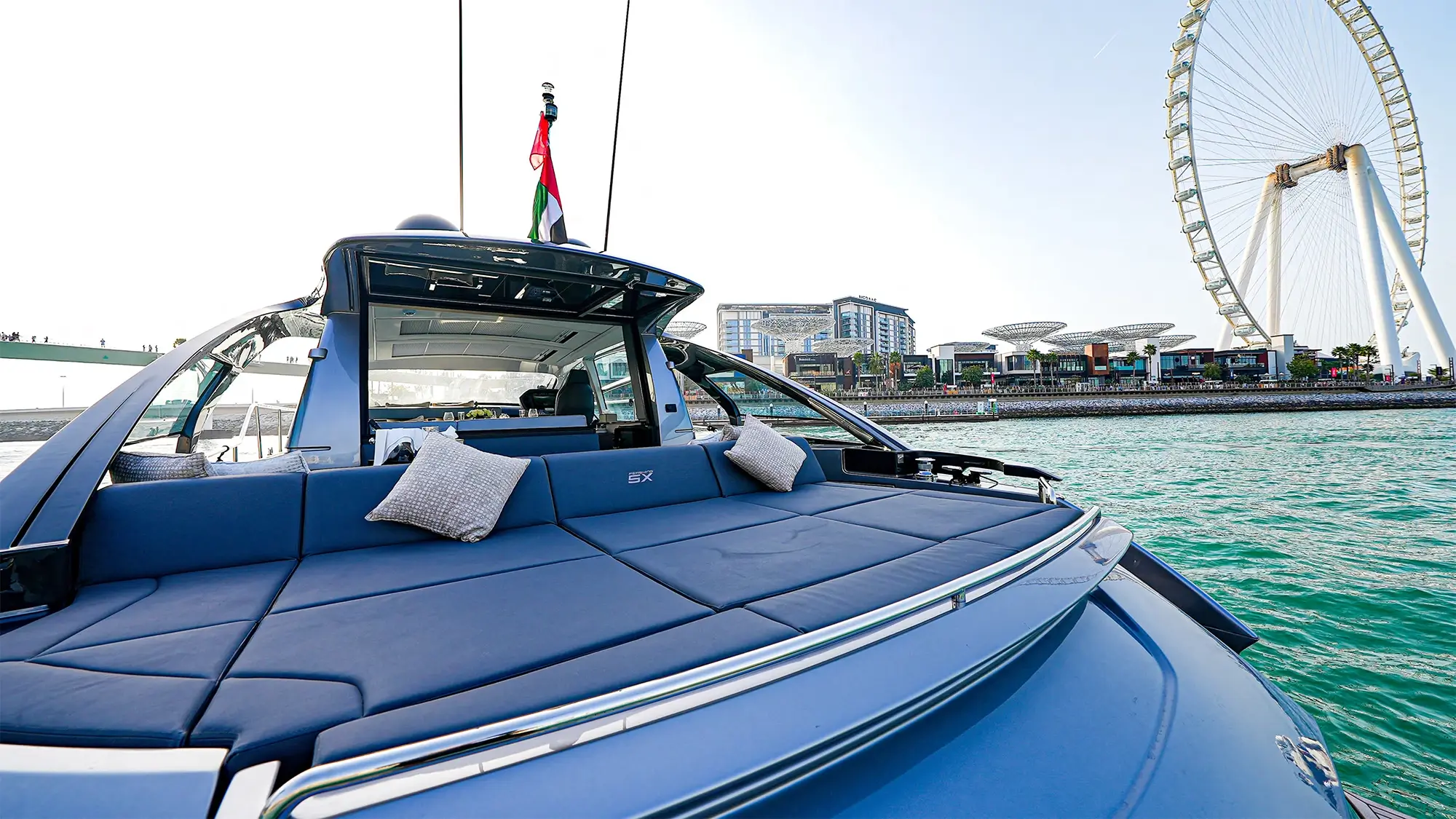 Pershing 5X stern lounge with Ain Dubai and Bluewaters behind