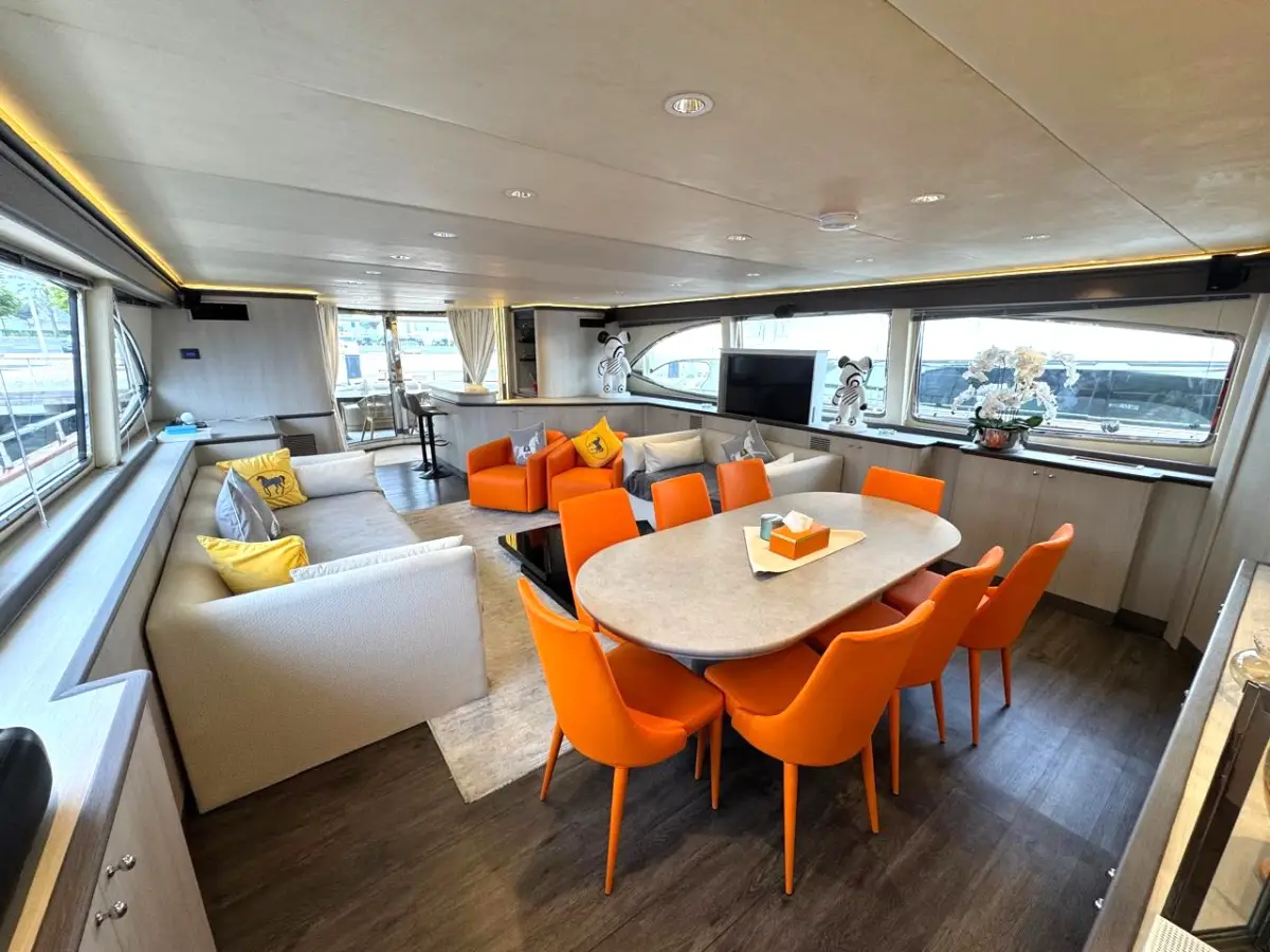 Azimut 100 Jumbo main saloon dining area with orange chairs