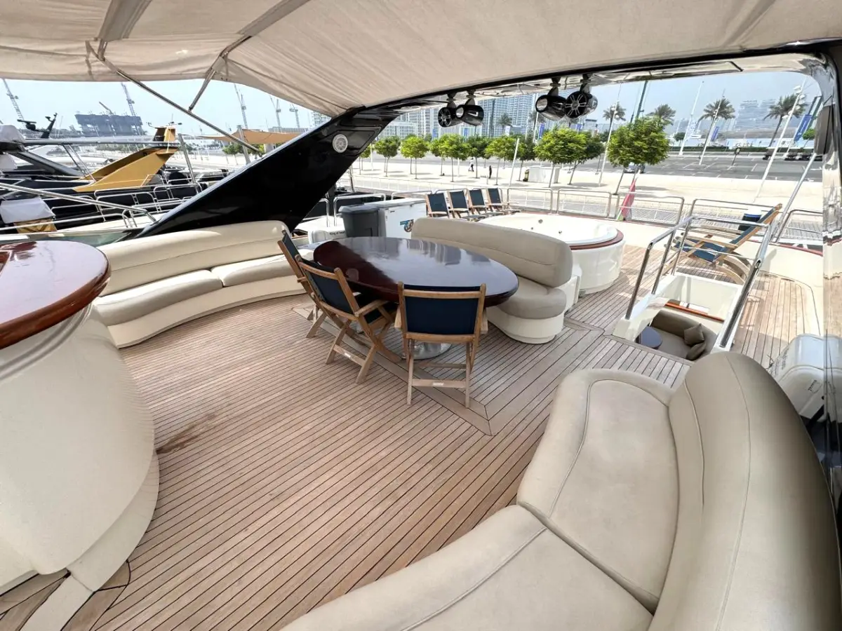 Azimut 100 Jumbo flybridge dining table beside the jacuzzi