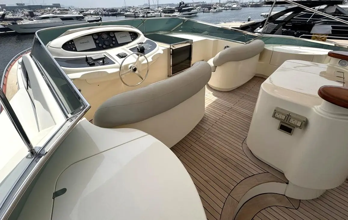 Azimut 100 Jumbo flybridge helm with wheel and curved seating