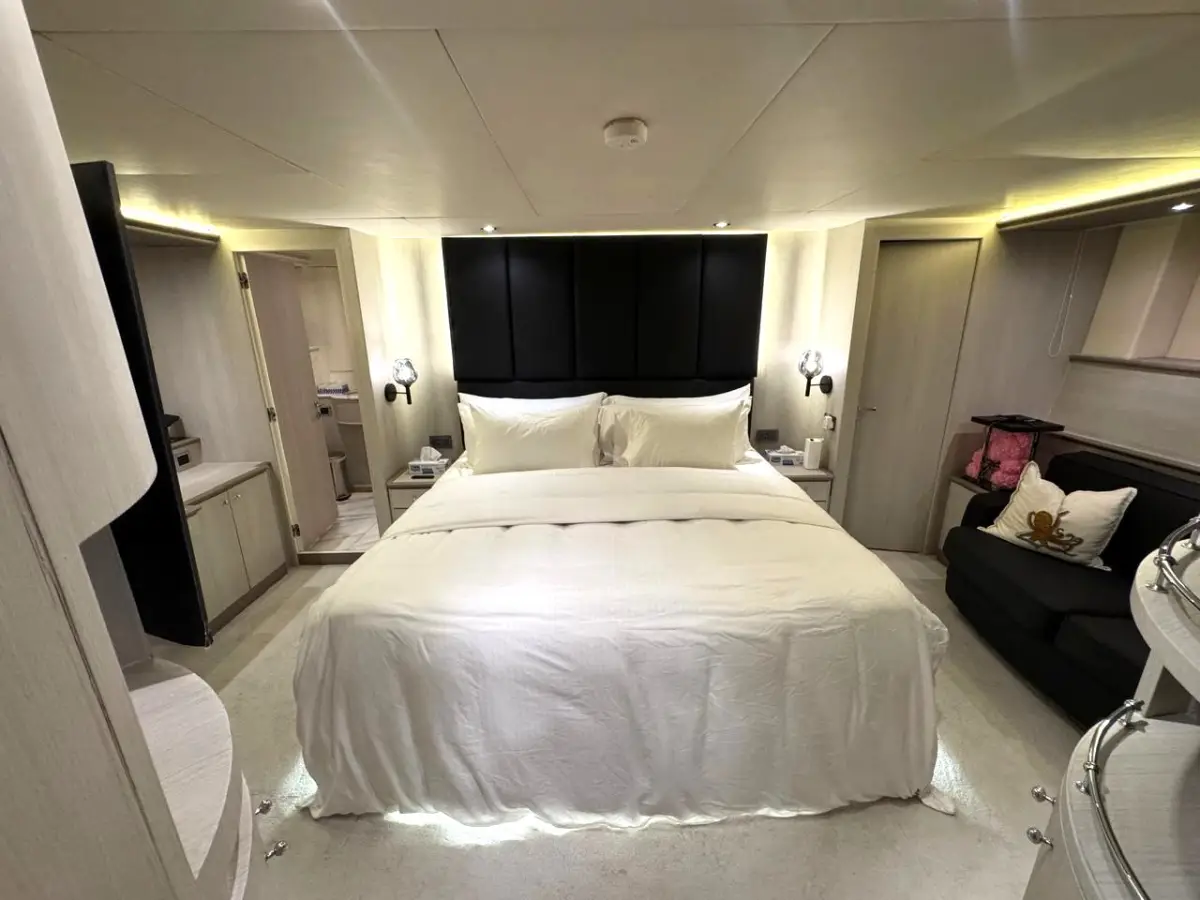 Azimut 100 Jumbo master cabin with padded headboard wall