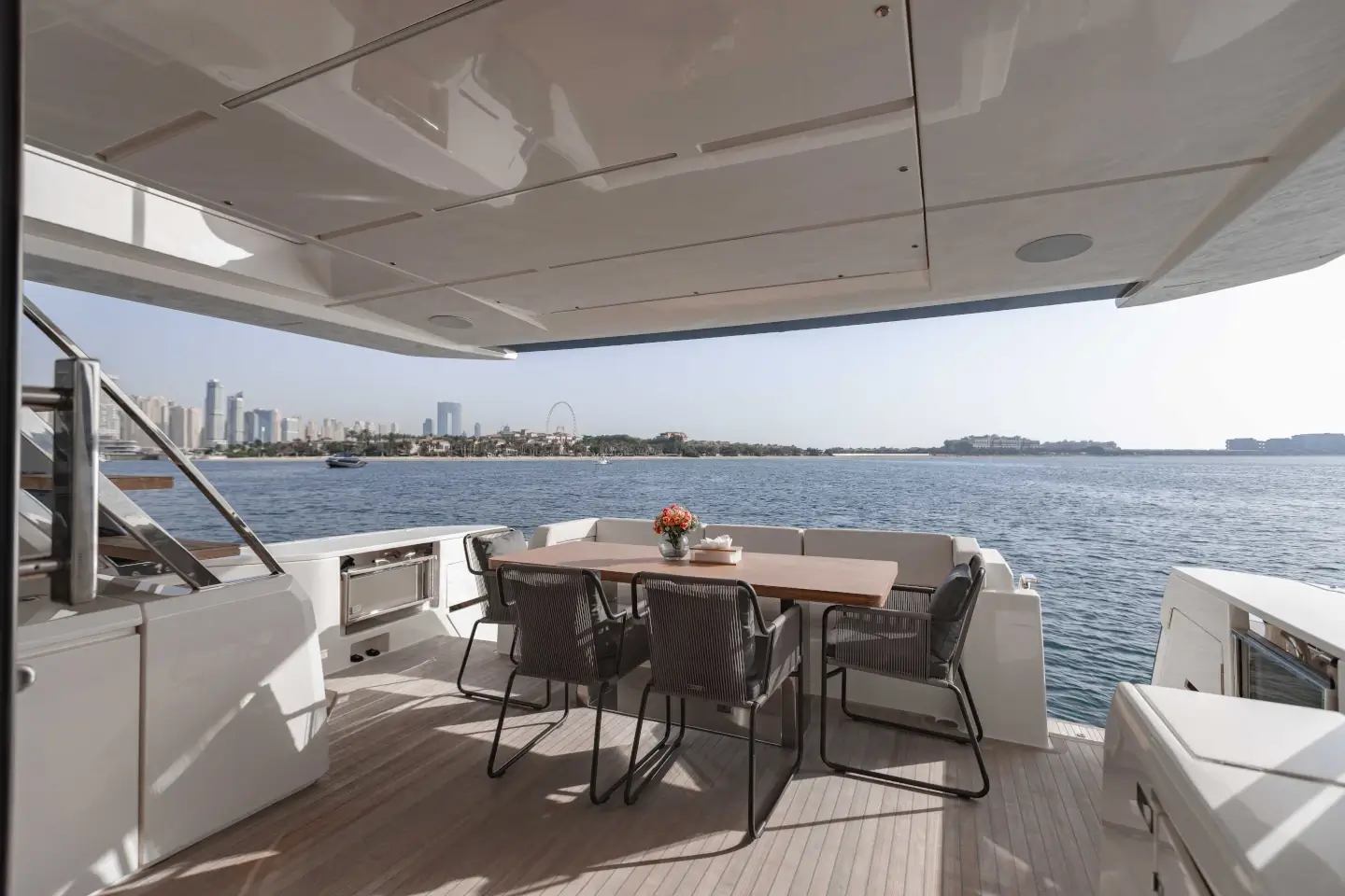 Ferretti 780 shaded aft cockpit dining and seating area