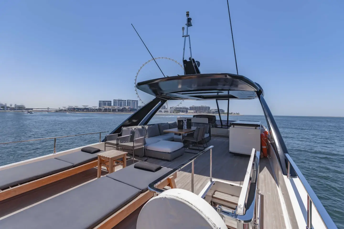 Ferretti 780 flybridge seating with Ain Dubai on the horizon