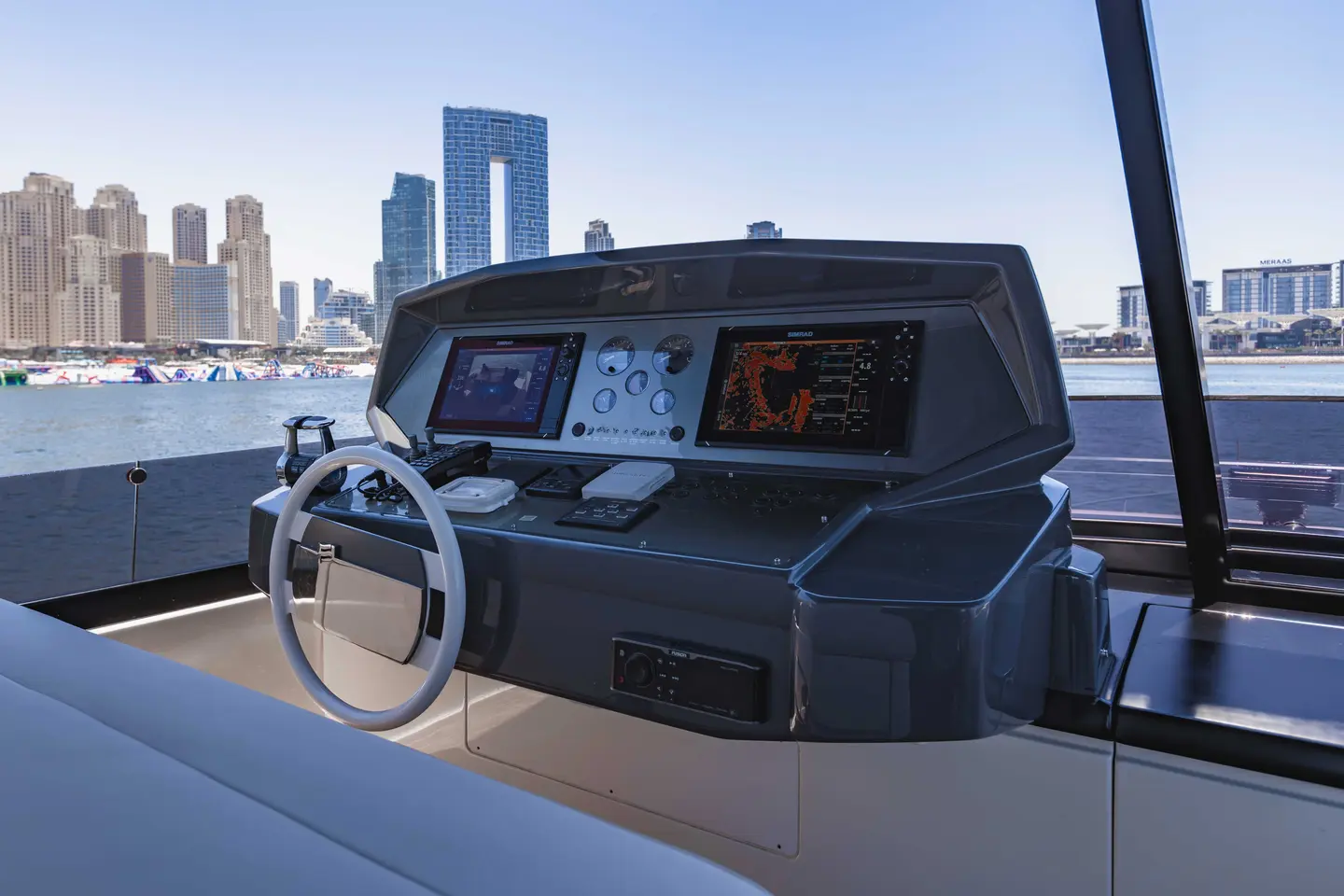 Ferretti 780 flybridge helm station with twin displays and joystick control